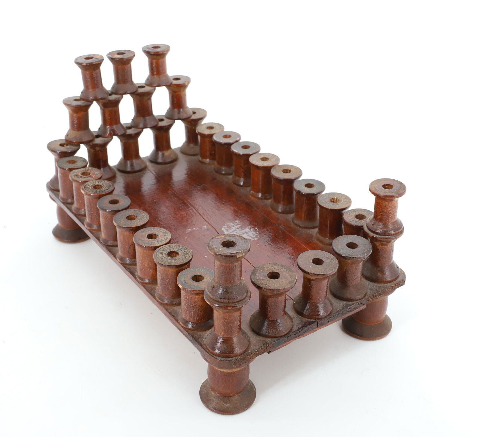 DOLL BED MADE FROM SPOOLS: DARK FINISH WITH FEATHER MATTRESS. 11" L. PLEASE READ CAREFULLY - Terms for Purchasing and Shipping of Auction Items. Please read carefully before bidding. All payments for purchases will be made thro