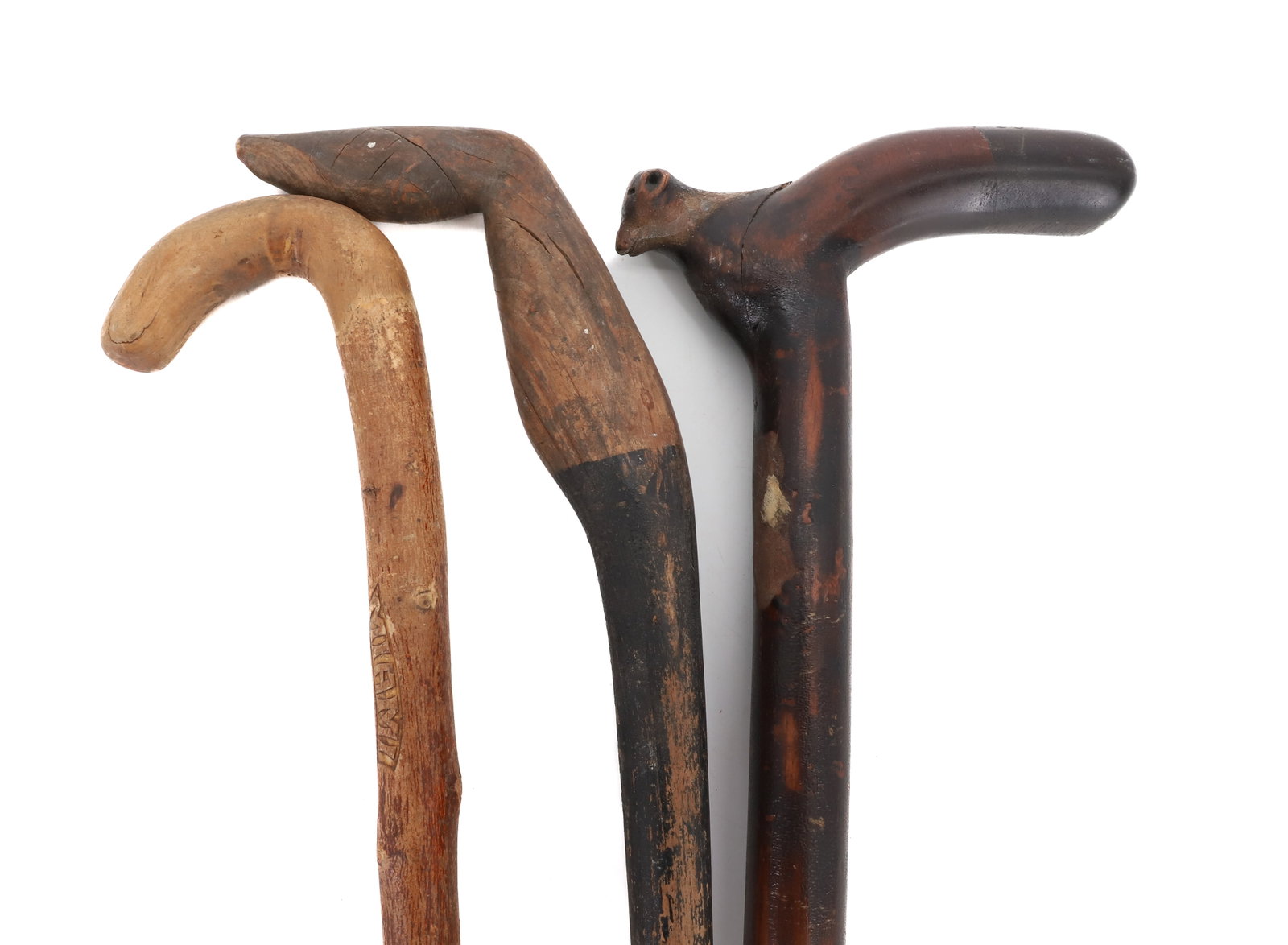 FOLK ART CANE LOT: (3) FOLK ART CANES INCLUDING; ONE WITH CARVED ANIMAL GRIP, ONE CARVED "MIAMI" 1934, AND ONE WITH CURVED HANDLE - LONGEST 33" PLEASE READ CAREFULLY - Terms for Purchasing and Shipping of Auction Items.
