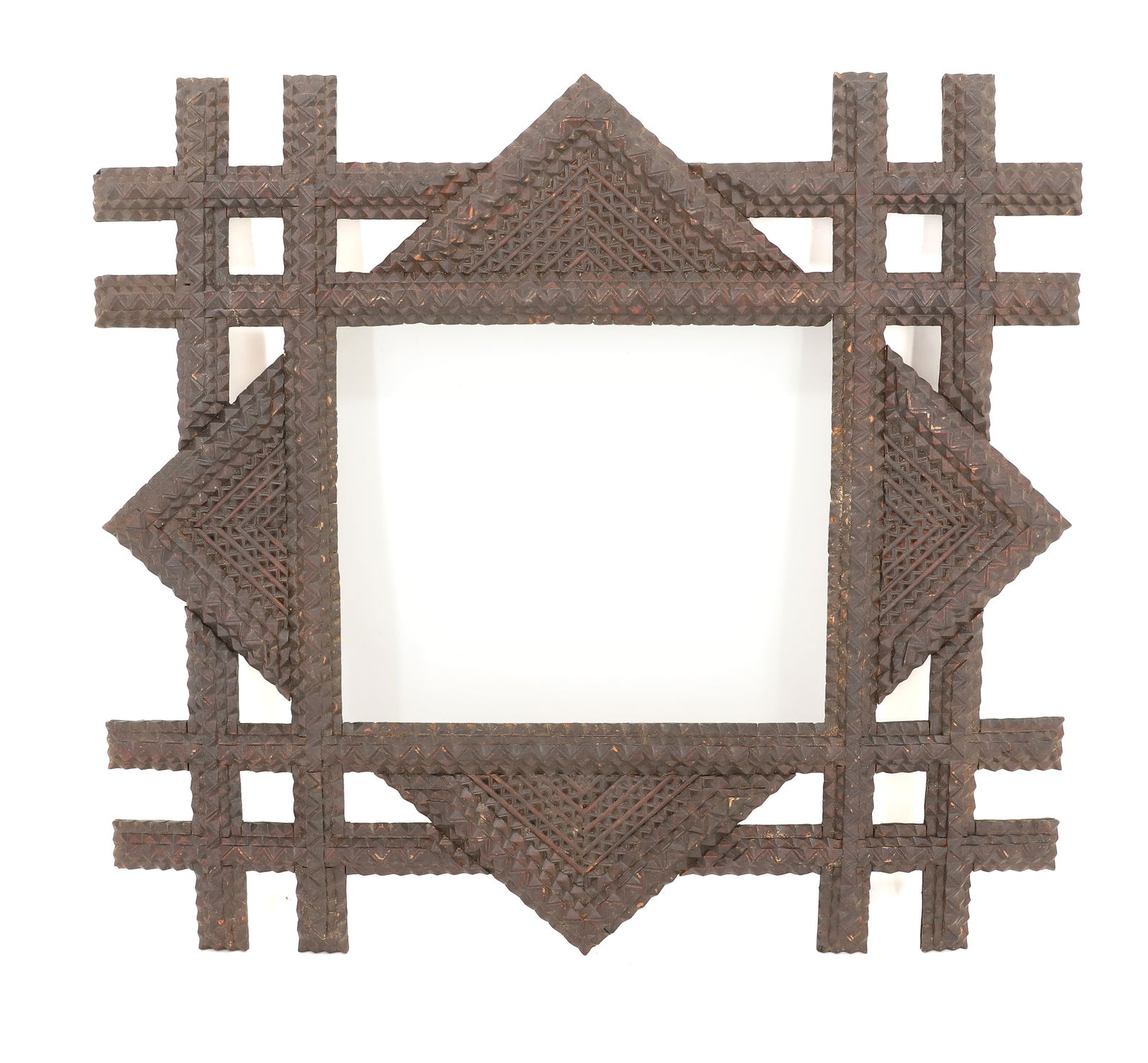 FOLK ART FRAME: CHIP CARVED WITH UNUSUAL CONFIGURATION. DARK SURFACE. 19 1/4" X 17 1/4". SIGHT VIEW 9 1/2" X 7 3/4". PLEASE READ CAREFULLY - Terms for Purchasing and Shipping of Auction Items. Please read carefully b