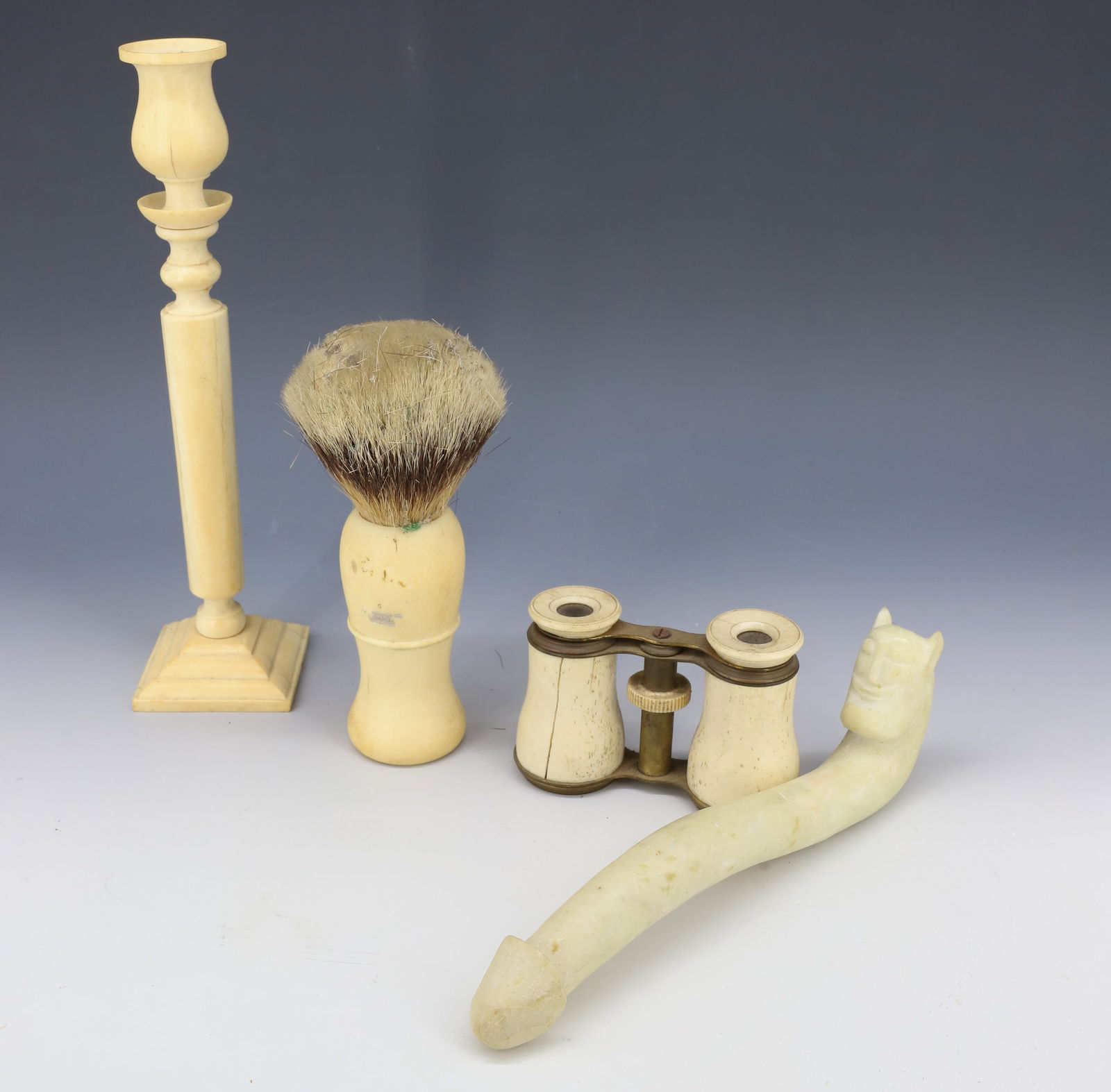 BONE SHAVING BRUSH, CANDLESTICK AND OPERA GLASSES: CANDLESTICK 10 1/4" H., BRASS/BONE OPERA GLASSES, SHAVING BRUSH 6 1/2" L. WITH, CARVED STONE PENIS. 8 1/2" L. PLEASE READ CAREFULLY - Terms for Purchasing and Shipping of Auction Items. Please read ca