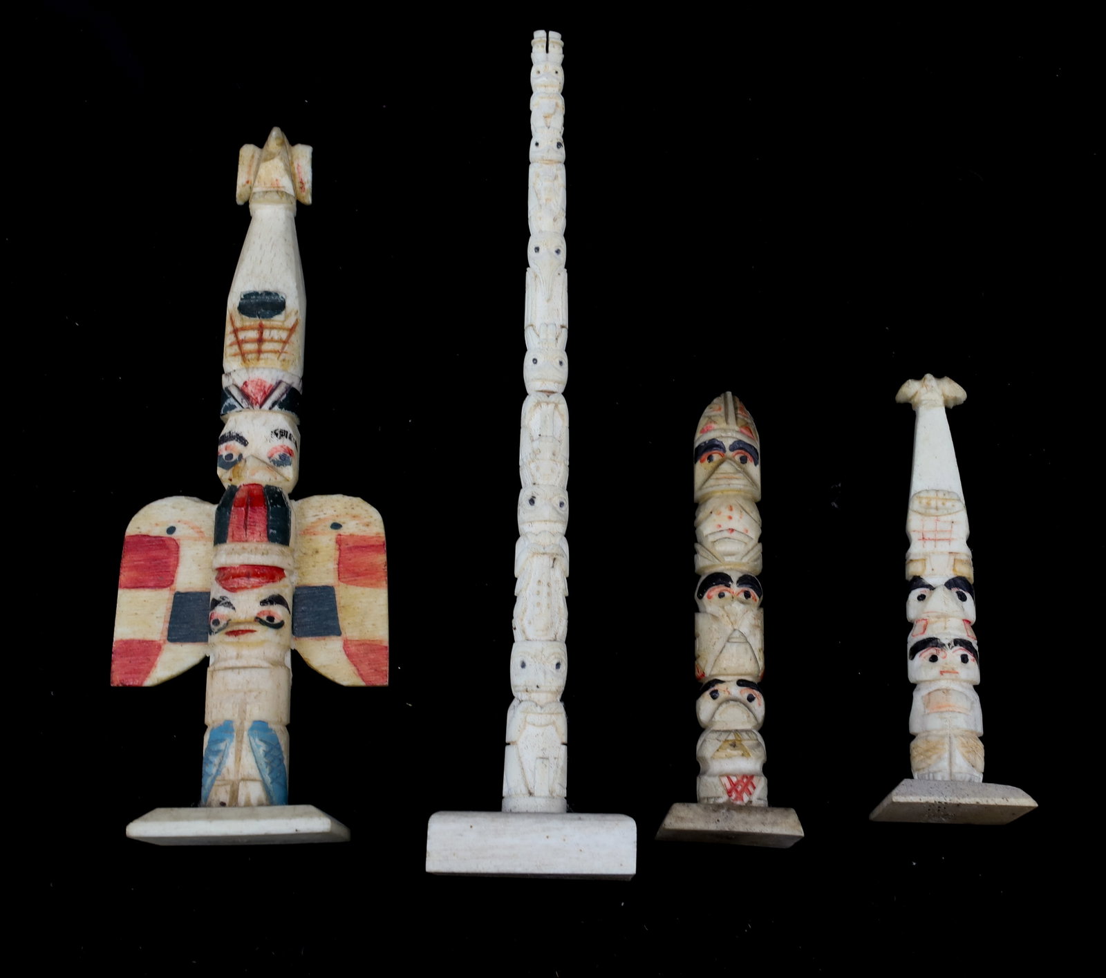 LOT OF CARVED MINIATURE TOTEM POLES: CARVED AND PAINTED BONE TOTEM POLES. 3" TO 6" H. PLEASE READ CAREFULLY - Terms for Purchasing and Shipping of Auction Items. Please read carefully before bidding. All payments for purchases will be ma
