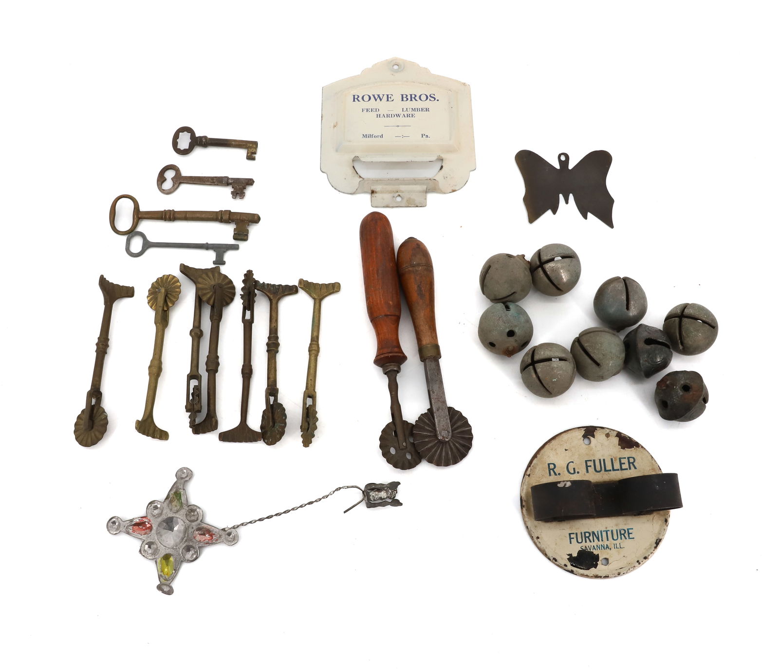 LOT OF BRASS AND METAL ADVERTISING: BRASS PIE CRIMPERS, XMAS TREE CANDLE HOLDER, TWO WALL HANGING ADVERTISERS (ROWE BROS., MILFORD, PA AND RG FULLER FURNITURE, SAVANNA, ILL), SLEIGH BELLS AND MORE. PLEASE READ CAREFULLY - Terms for Purc