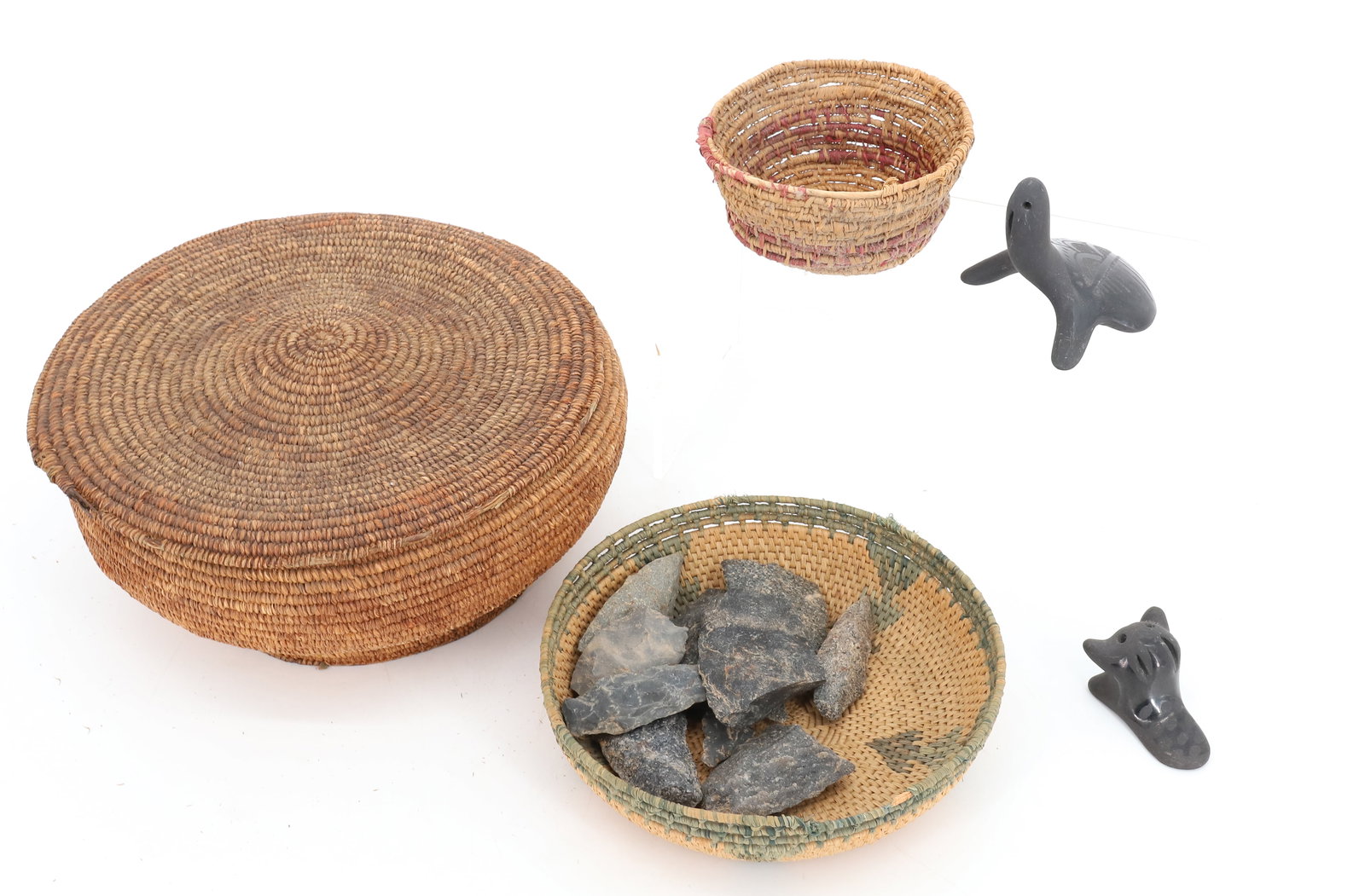 LOT OF NATIVE AMERICAN ITEMS: INCLUDING: BASKETS (LARGEST 8 1/2" D.), SANTA CLARA POTTERY ANIMALS, STONE POINTS AND MORE. PLEASE READ CAREFULLY - Terms for Purchasing and Shipping of Auction Items. Please read carefully before bid