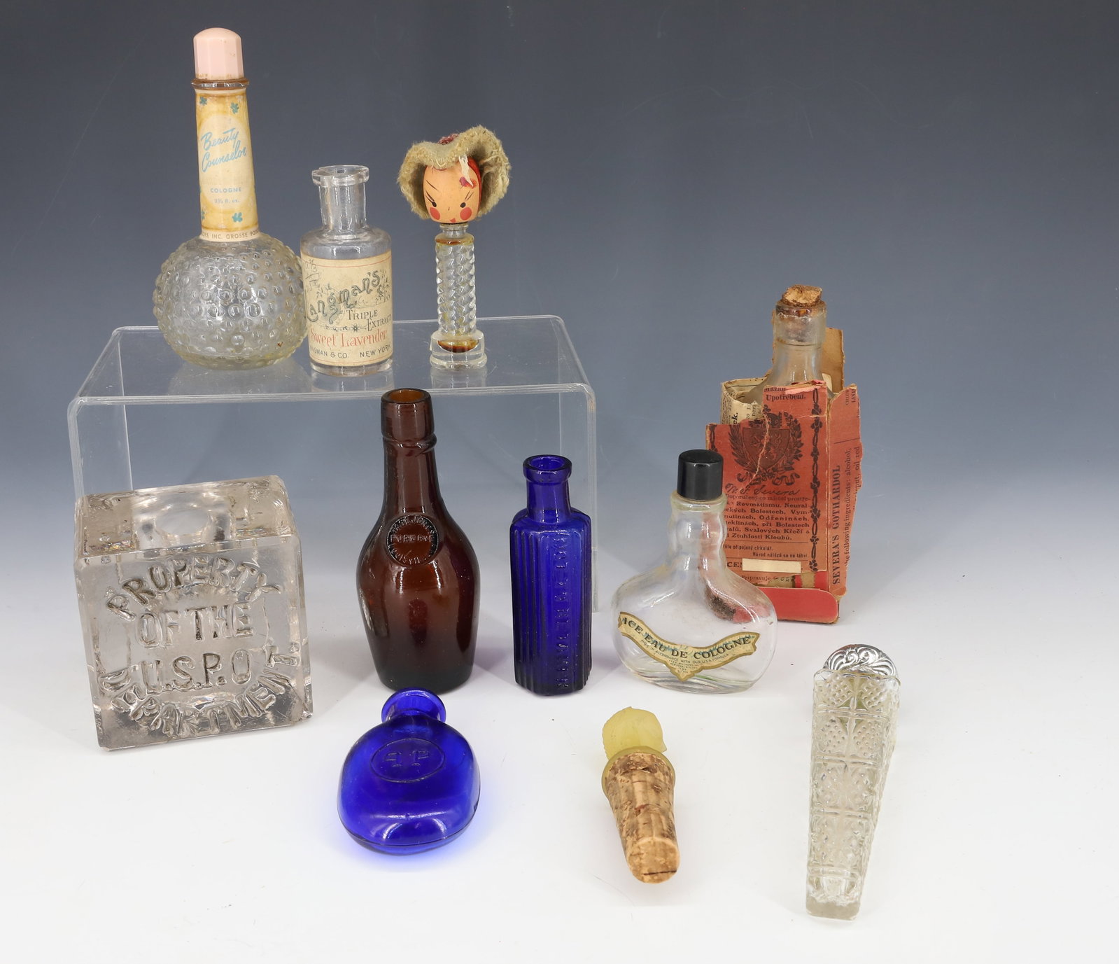 LOT OF PERFUME BOTTLES, BOTTLES AND MORE: VARIOUS VINTAGE PERFUME BOTTLES, TWO COBALT BOTTLES AND INKWELL BASE "PROPERTY OF THE USPO DEPARTMENT". PLEASE READ CAREFULLY - Terms for Purchasing and Shipping of Auction Items. Please read carefull