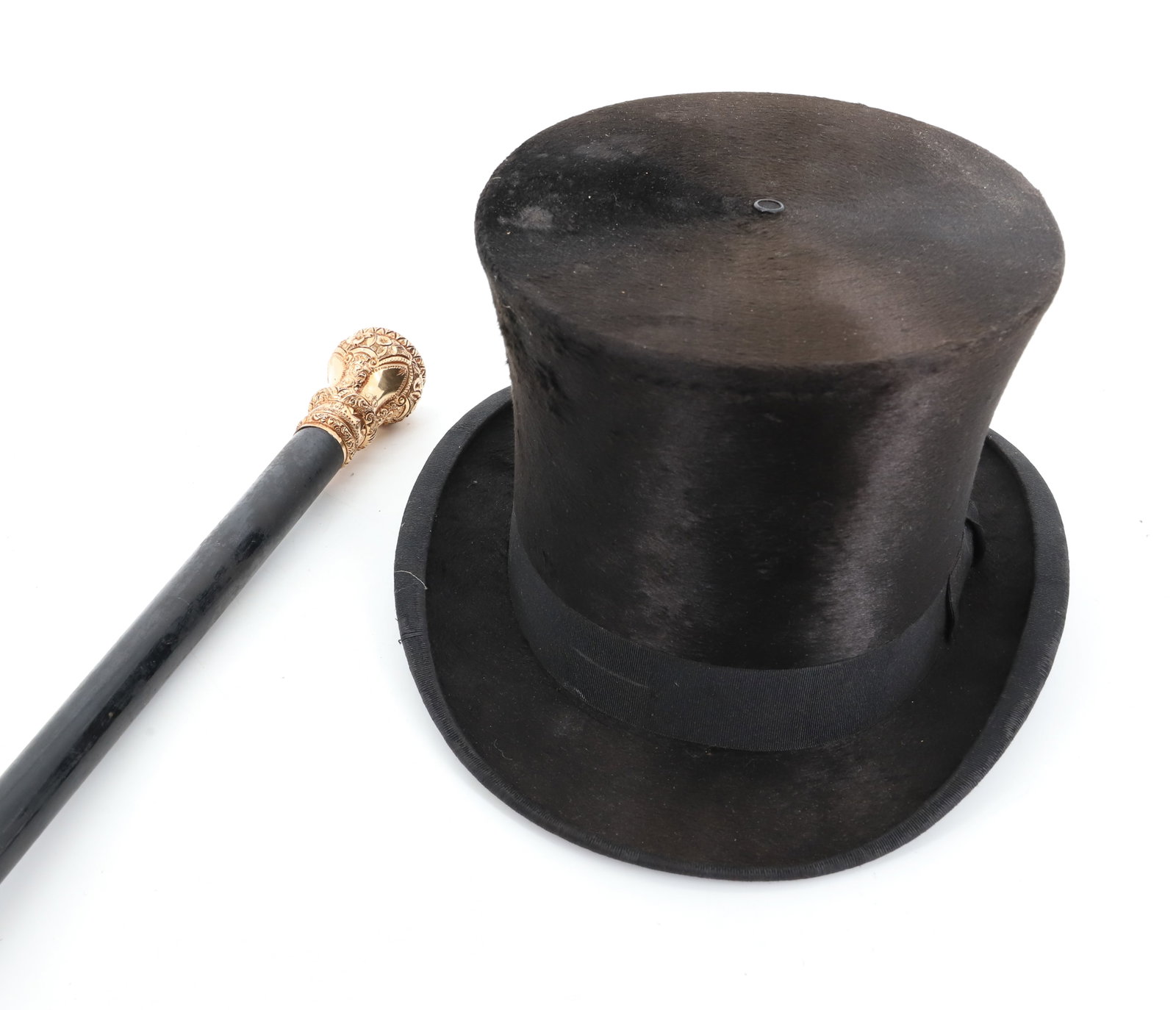 ANTIQUE TOP HAT AND GOLD TOPPED WALKING STICK / CANE: ENGLISH TOP HAT MRKD. SINCLAIR & CO. LONDON WITH WALKING STICK WITH ORNATE GOLD-FILLED TOPPER. HALLMARKED. AND MARKED "676A". 36" L. PLEASE READ CAREFULLY - Terms for Purchasing and Shipping of Auctio
