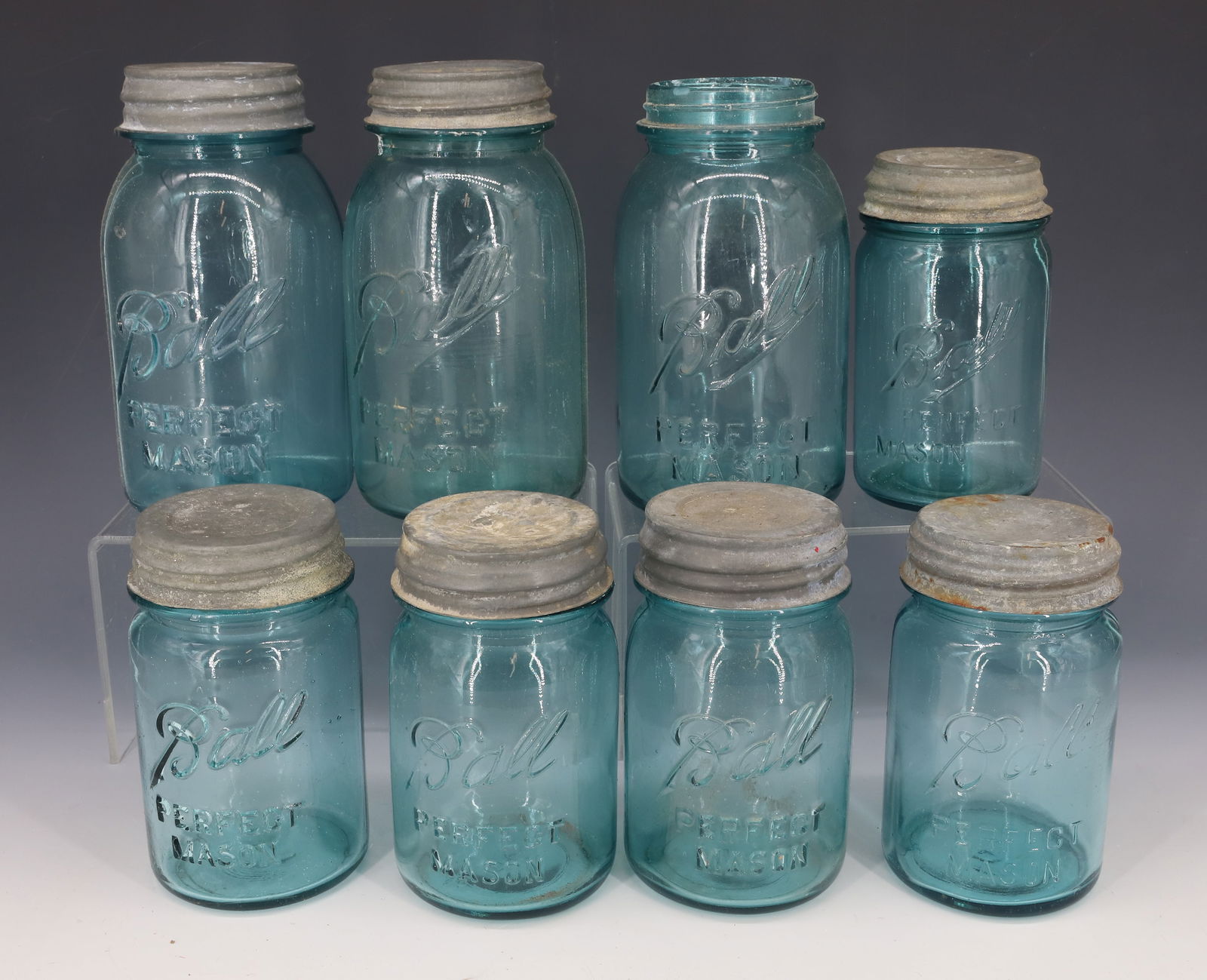LOT OF (8) BALL FRUIT JARS: SEVEN HAVE ZINC LIDS. 4 3/4" TO 6 1/2" HEIGHTS. PLEASE READ CAREFULLY - Terms for Purchasing and Shipping of Auction Items. Please read carefully before bidding. All payments for purchases will be mad