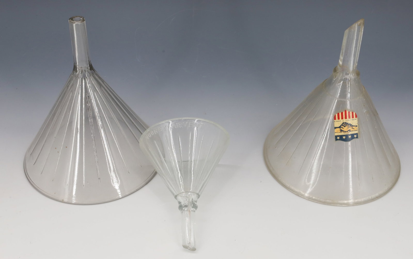 LOT OF GLASS FUNNELS: 4 1/2" TO 6 3/4" HEIGHTS. PLEASE READ CAREFULLY - Terms for Purchasing and Shipping of Auction Items. Please read carefully before bidding. All payments for purchases will be made through LiveAuctione