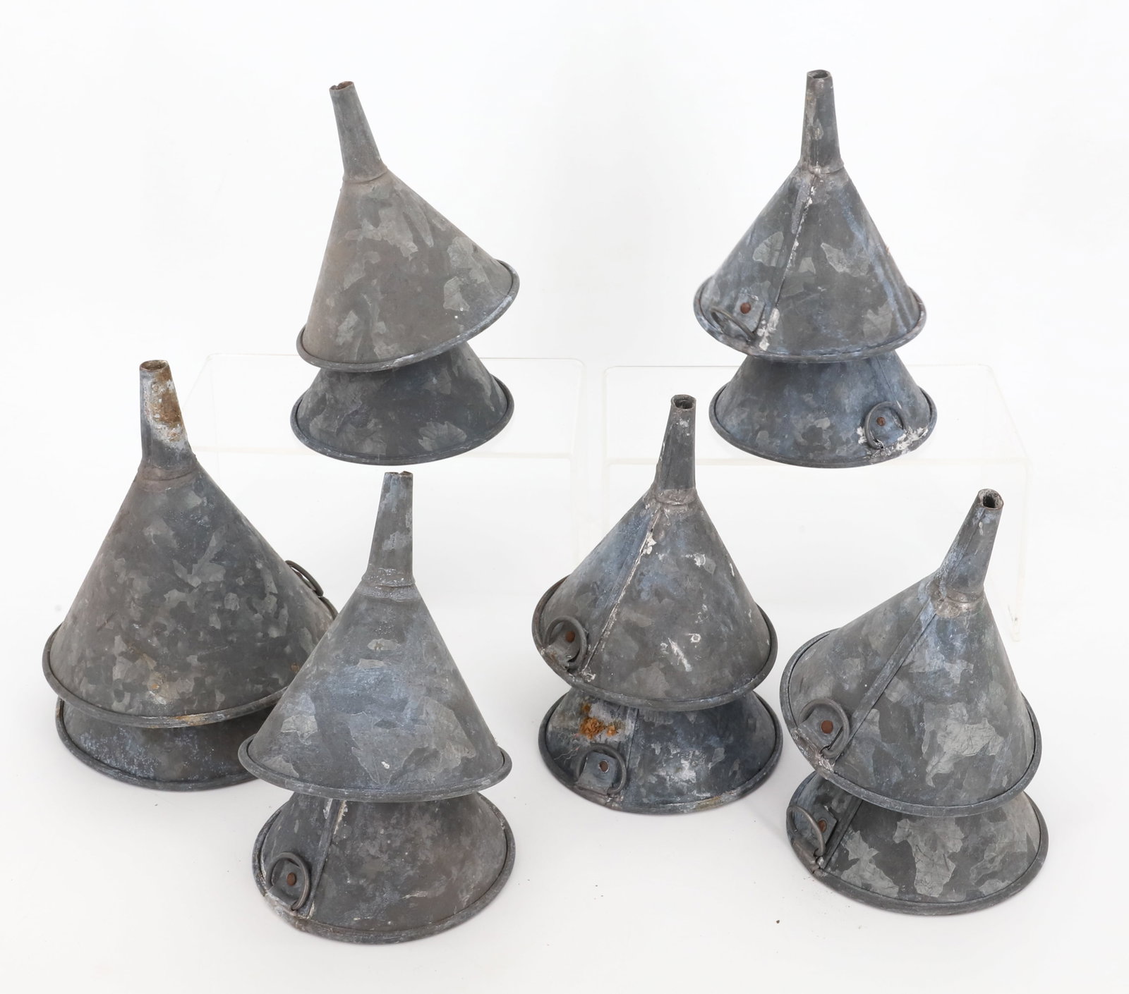 (12) GALVANIZED METAL FUNNELS: 4 1/4" TO 5 1/4" DIAMETERS. PLEASE READ CAREFULLY - Terms for Purchasing and Shipping of Auction Items. Please read carefully before bidding. All payments for purchases will be made through LiveAuctio