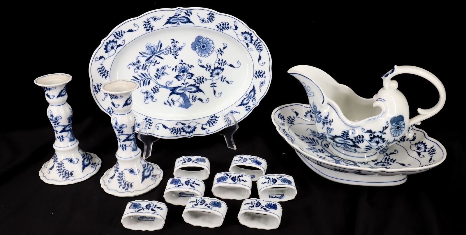 (13) BLUE DANUBE PATTERN PORCELAIN GRAVY BOAT, FOOTED PLATTER, NAPKIN RINGS,CANDLESTICKS: INCLUDES (8) NAPKIN RINGS, FOOTED PLATTER 11 1/2" X 9", ORNATE GRAVY BOAT 6 1/2" X 9 3/4", TWO CANDLESTICKS 6 1/2"H,PLATTER 12" X 9" PLEASE READ CAREFULLY - Terms for Purchasing and Shipping of Auctio