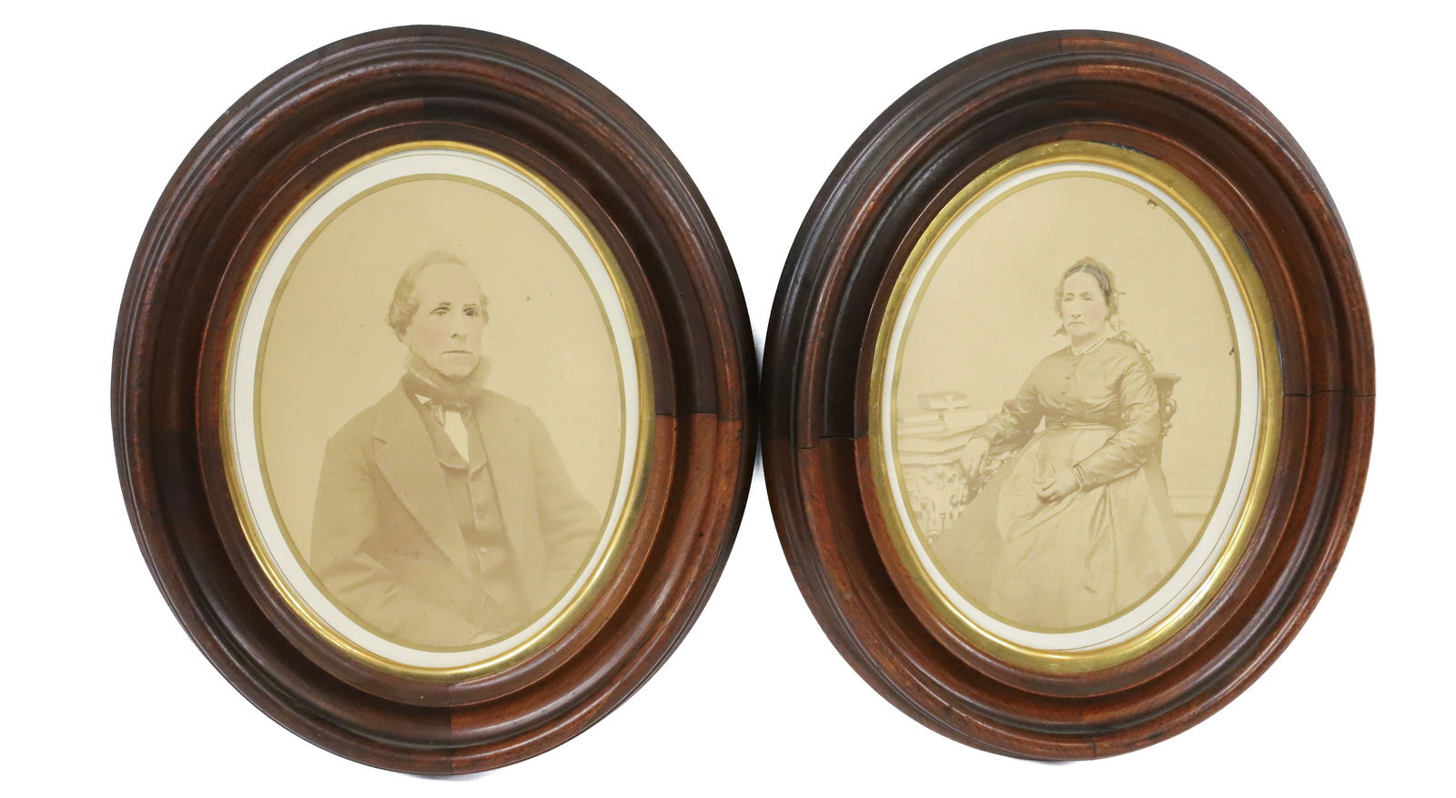 (2) VICTORIAN FRAMED PHOTOS OVAL WOOD FRAMES: ALL ORIGINAL TINTED PHOTO OF MAN AND LADY OVAL WALNUT FRAMES 13"X 11" PLEASE READ CAREFULLY - Terms for Purchasing and Shipping of Auction Items. Please read carefully before bidding. All payments for