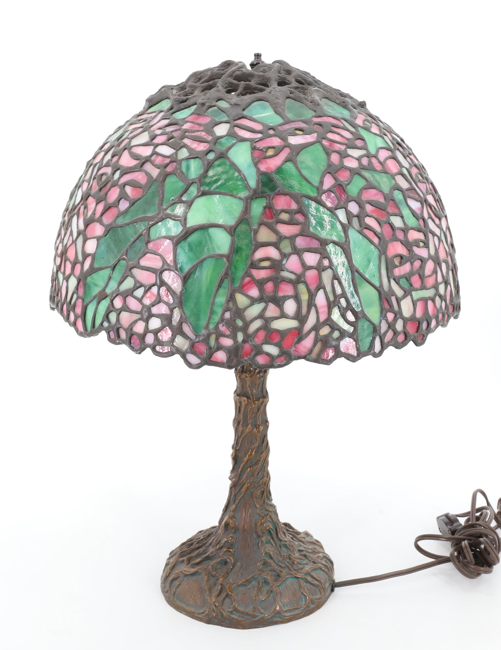 CONTEMPORARY LEADED GLASS SHADE/LAMP: HEAVY CAST BRASS TREE TRUNK BASE, SHADE PINK AND GREEN FLOWERS AND FOLIAGE 19" X 14" PLEASE READ CAREFULLY - Terms for Purchasing and Shipping of Auction Items. Please read carefully before bidding. A