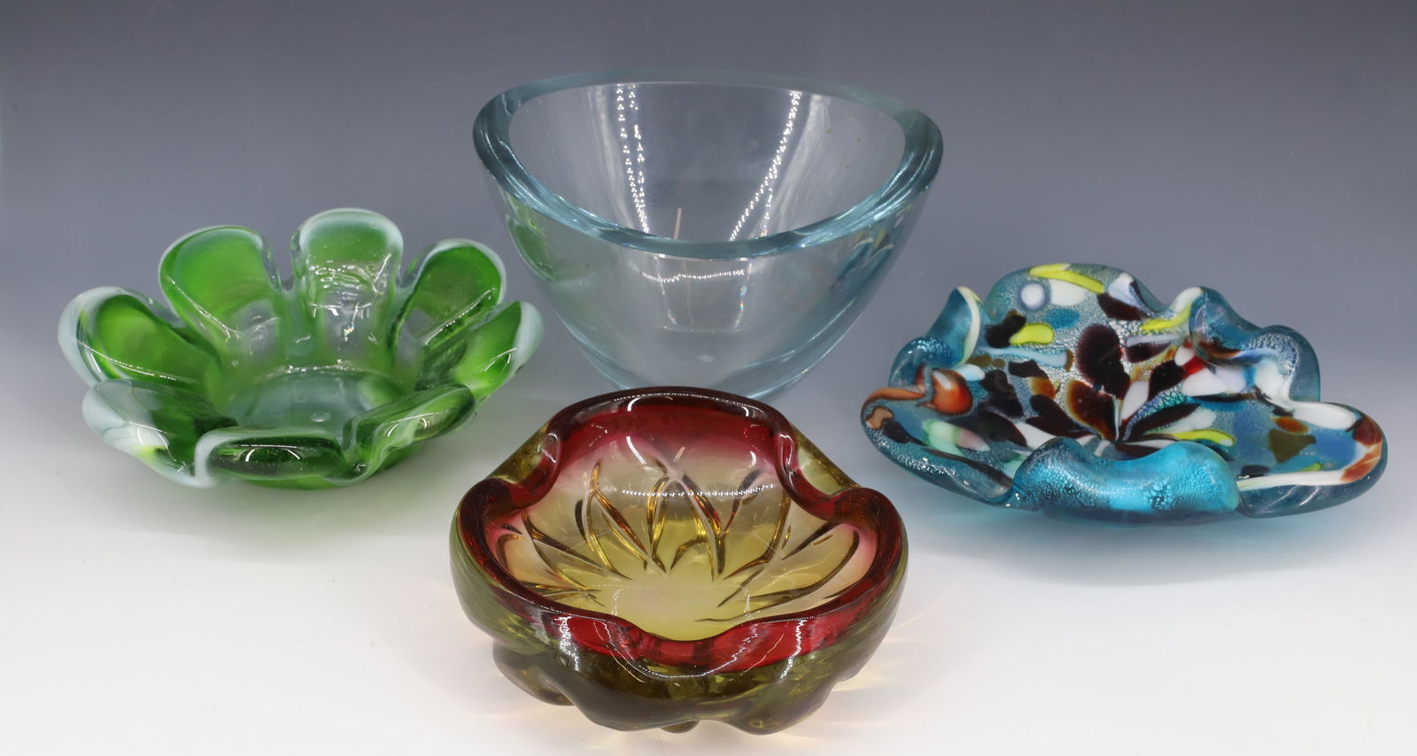 (4) MID-CENTURY GLASS BOWLS: SWEDISH TRIANGLE SHAPE BOWL, ITALIAN RED/AMBER ASHTRAY, ASHTRAY WITH MULTI COLOR GLASS AND PRESSED PETAL BOWL GREEN/WHITE 3" X 8", 8"DIA, 2 1/2" X 6 1/2", 4 3/4" X 8 1/4" PLEASE READ CAREFULLY - Terms