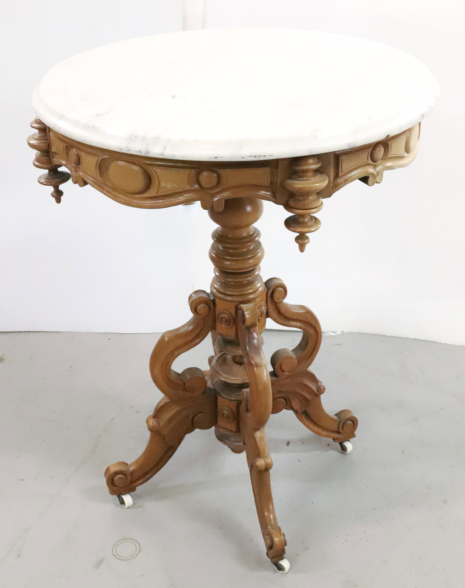 OVAL VICTORIAN STAND WITH MARBLE TOP: OVAL MARBLE TOP STAND WITH CARVED BASE PLEASE READ CAREFULLY - Terms for Purchasing and Shipping of Auction Items. Please read carefully before bidding. All payments for purchases will be made through