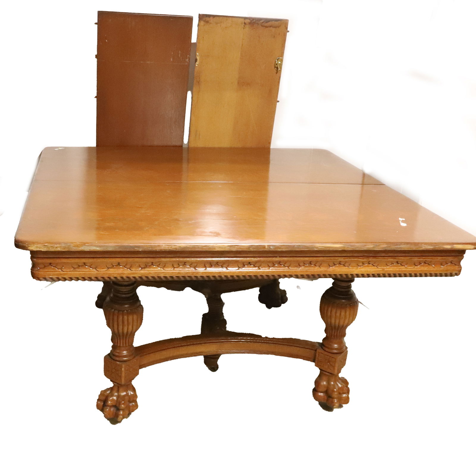 LARGE OAK DINING ROOM TABLE, HERTER BROs. NY: 53 1/2" X 54" OAK TABLE WITH CARVED BASE AND TWO LEAVES PLEASE READ CAREFULLY - Terms for Purchasing and Shipping of Auction Items. Please read carefully before bidding. All payments for purchases wil