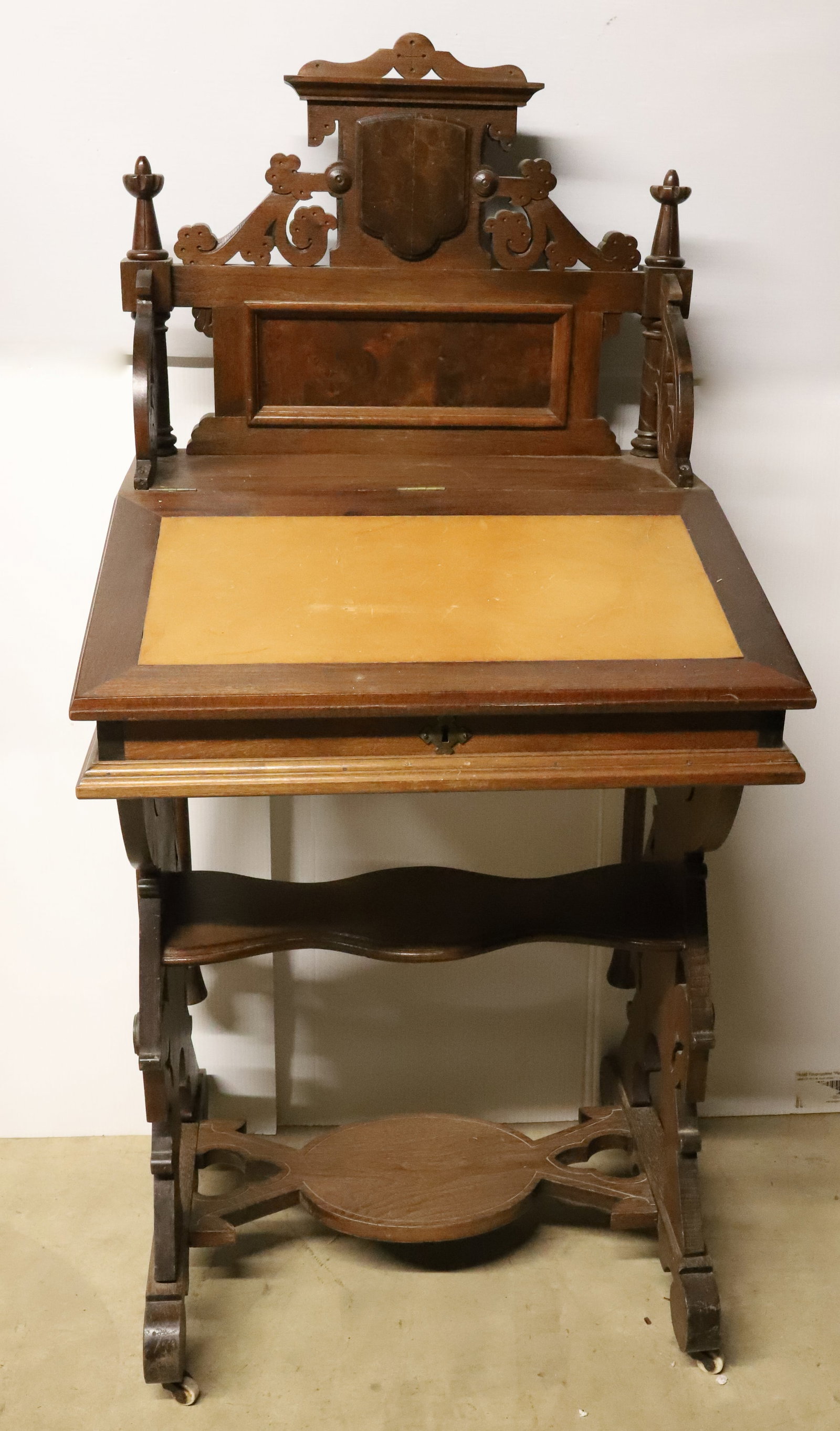 EASTLAKE WALNUT SLANT FRONT WRITING DESK: PLEASE READ CAREFULLY - Terms for Purchasing and Shipping of Auction Items. Please read carefully before bidding. All payments for purchases will be made through LiveAuctioneers.com payment processing
