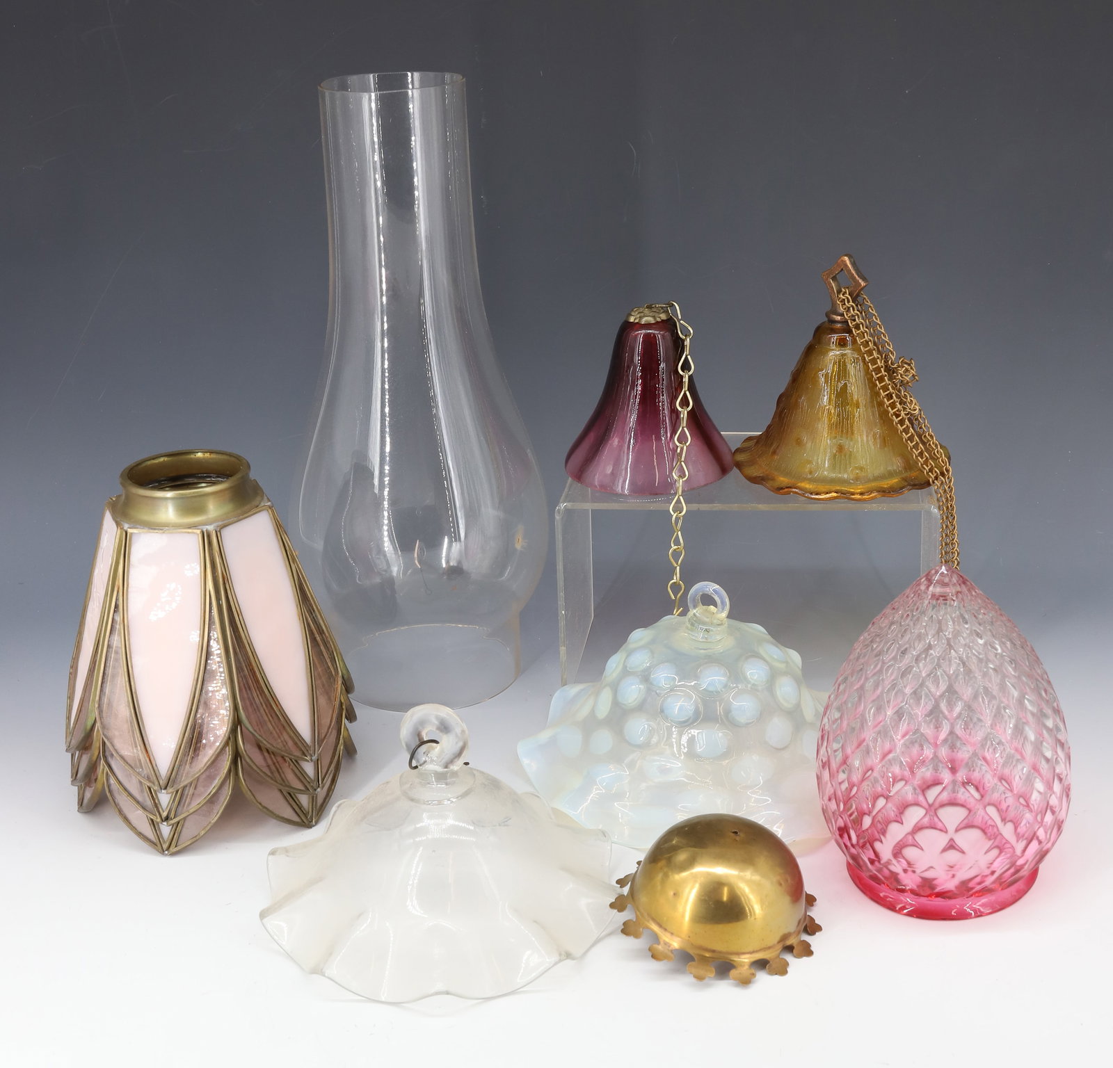 (9) ANTIQUE LIGHTING LOT: , THREE LEADED SHADES, LARGE CHIMNEY, FOUR ANTIQUE SMOKING BELLS, AND HAND BLOWN EXPANDED DIAMOND POINTED SHADE LEADED SHADE 5" WITH 2" FITTER, 3 1/2" TO 7" DIA POINTED SHADE 5 3/4" X 3 1/8" FITTER PL
