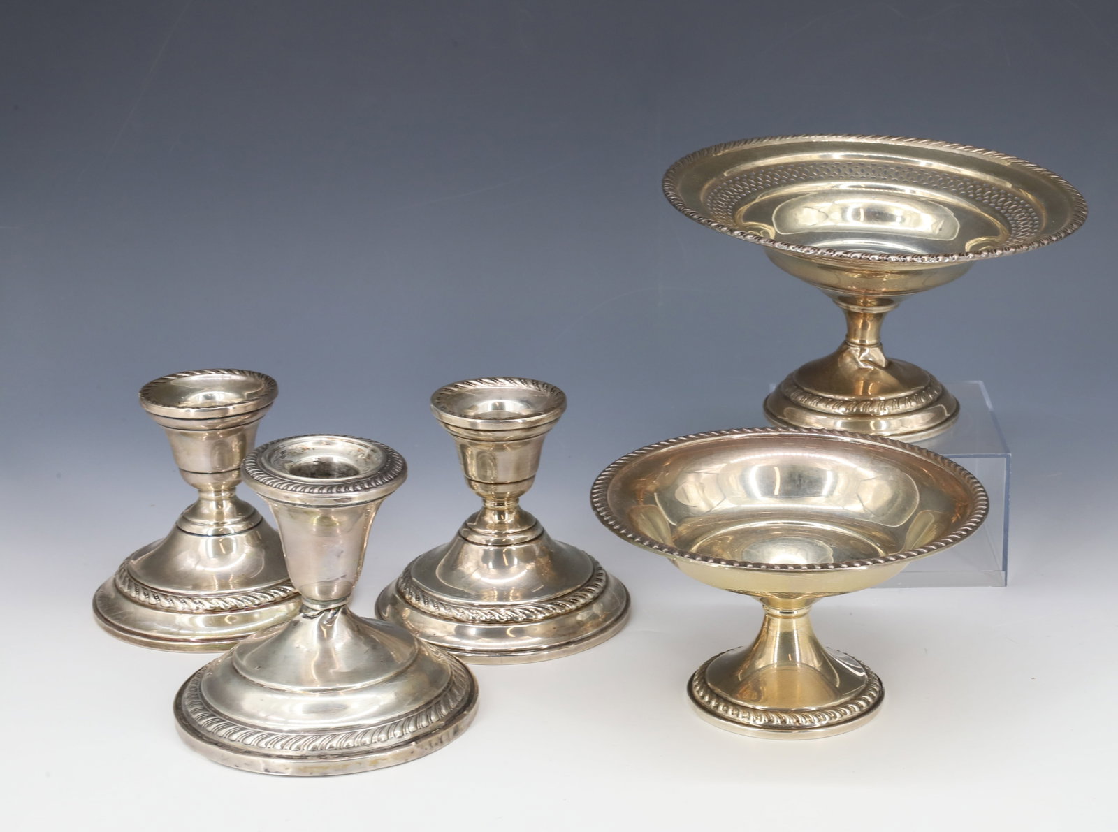 (5) VINTAGE WEIGHTED STERLING SILVER COMPOTES,CANDLE HOLDERS: TWO COMPOTES 3 1/2" X 6 1/2", 3" X 5 1/4", TWO MATCHING CANDLE HOLDERS AND SINGLE CANDLE HOLDER 3 1/2"H PLEASE READ CAREFULLY - Terms for Purchasing and Shipping of Auction Items. Please read carefull