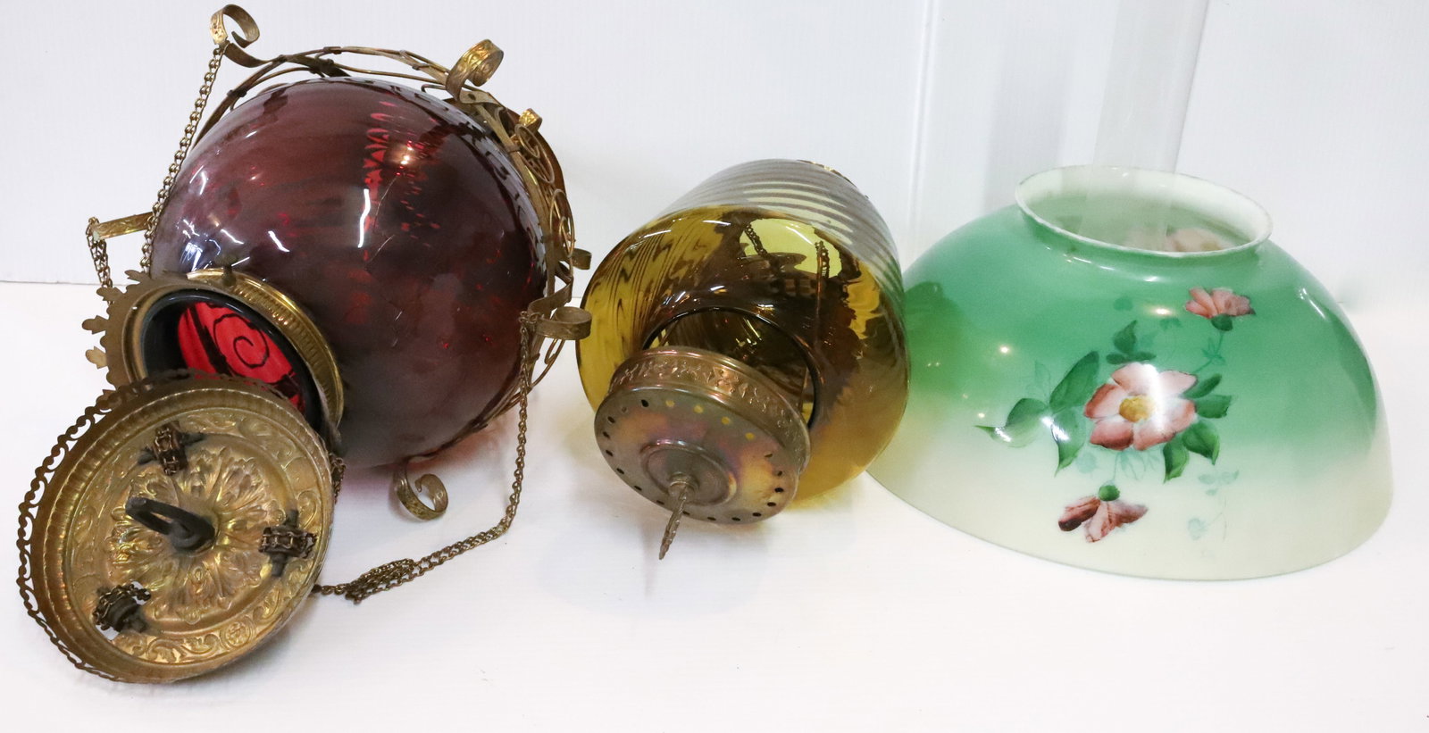 (3) HANGING LIGHT,SHADE AND HANGING LIGHT FRAME: HANGING LAMP WITH AMBER SHADE NOT ELECTRIFIED, HAND PAINTED SHADE AND HANGING LIGHT FRAME WITH CRACKED CRANBERRY SHADE,ORNATE PULL DOWN BRASS FRAME HANGING LIGHT 18", SHADE 6 1/2" X 14", HANGING FRAME