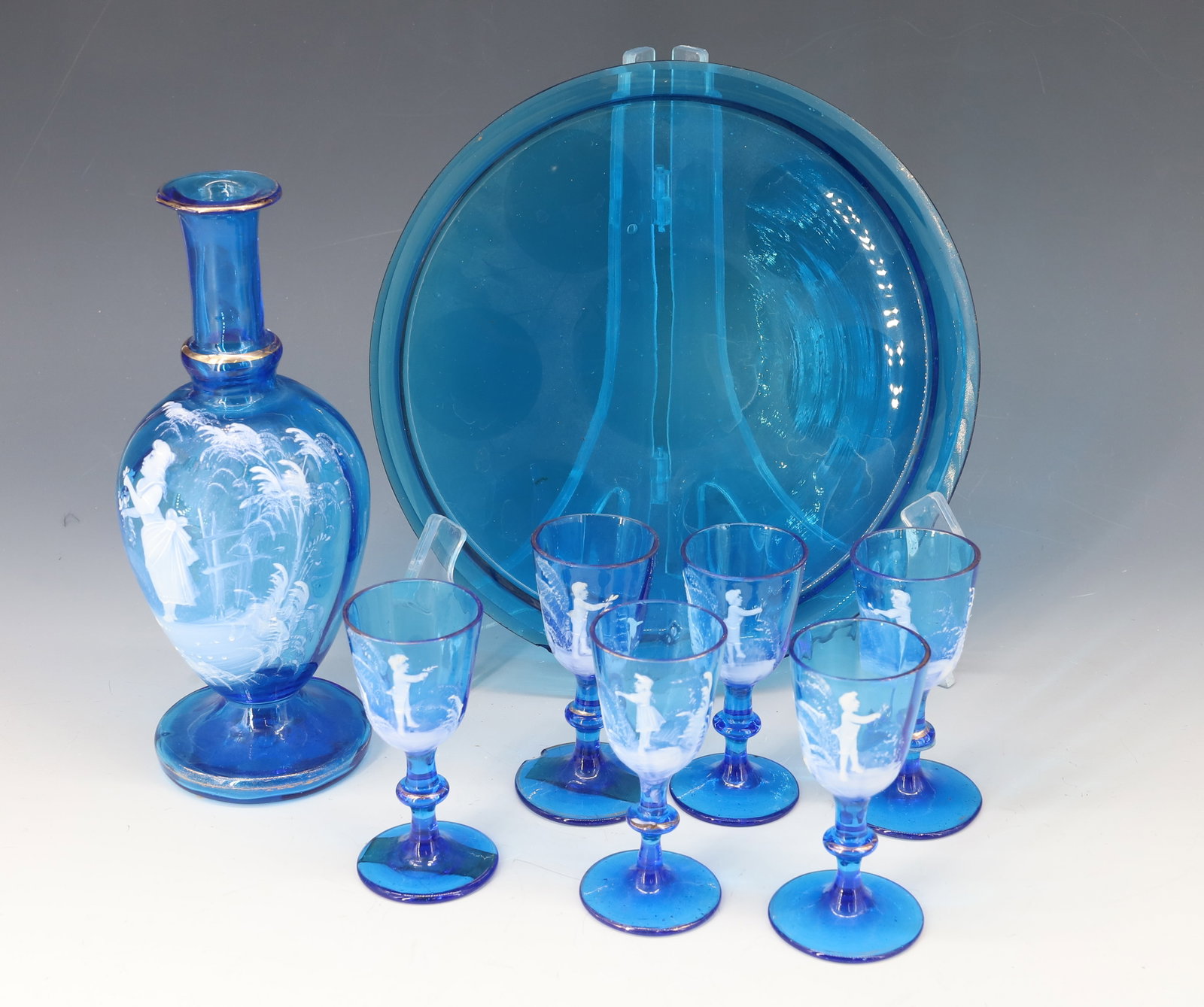 (8) ANTIQUE MARY GREGORY GLASS: DECANTER, SIX GLASSES, AND TRAY 8"H,3 1/4"H 8" DIA PLEASE READ CAREFULLY - Terms for Purchasing and Shipping of Auction Items. Please read carefully before bidding. All payments for purchases will be 