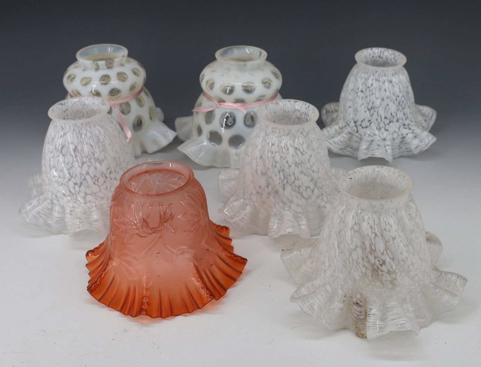 (7) ELECTRIC LIGHT GLASS SHADES: (4) MATCHING RUFFLED RIM WITH SPECKLED WHITE AND CLEAR, (2) COIN SPOT OPALESCENT RUFFLED RIMS AND PINK FLORAL PATTERN RUFFLED RIM 4 1/2" X 2 1/4" FITTER RING PLEASE READ CAREFULLY - Terms for Purchasi