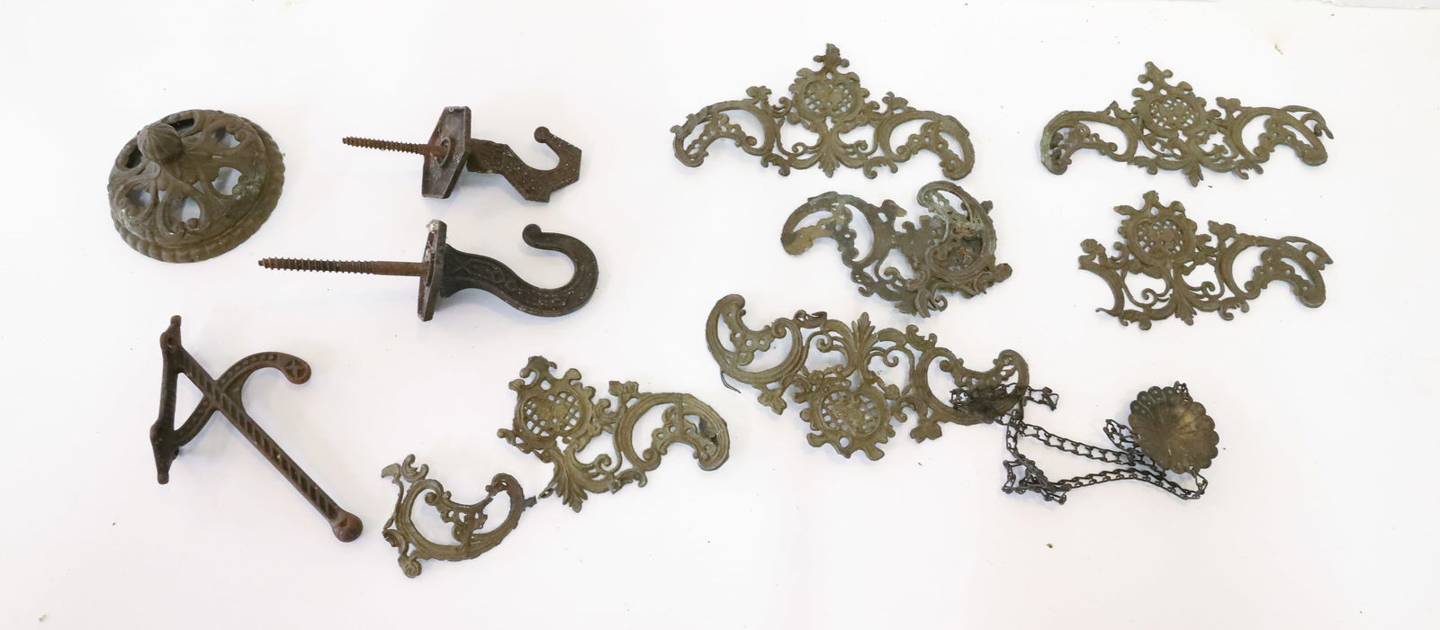 (3) CAST IRON HOOKS, CHANDELIER AND COAT: TWO CHANDELIER CAST IRON HOOKS EASTLAKE MOTIF, CAST IRON COAT HOOK, SPELTER LAMP SHADE CAP AND SPELTER ROCOCO PARTS 5 1/2" PLEASE READ CAREFULLY - Terms for Purchasing and Shipping of Auction Items. P