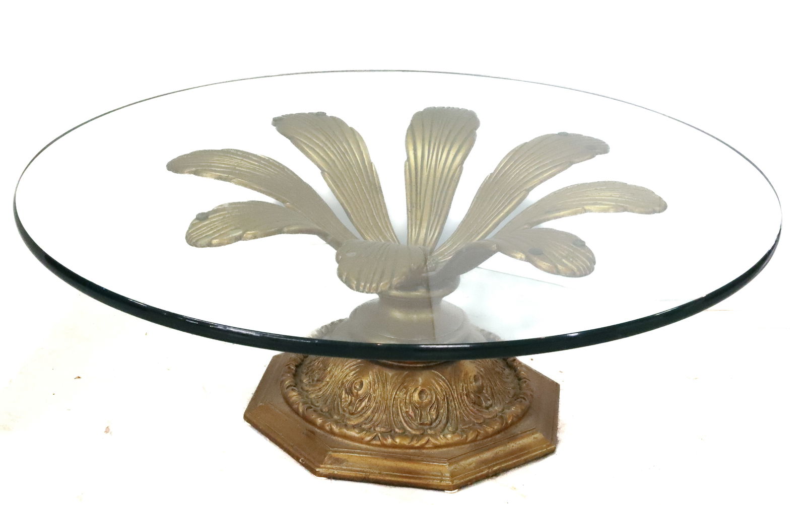 MID CENTURY GLASS TOP COFFEE TABLE: LARGE SPELTER BASE WITH LARGE PETALS AND FLOWER CENTER, 1" THICK ROUND GLASS TOP 15" X 40" PLEASE READ CAREFULLY - Terms for Purchasing and Shipping of Auction Items. Please read carefully before bidd