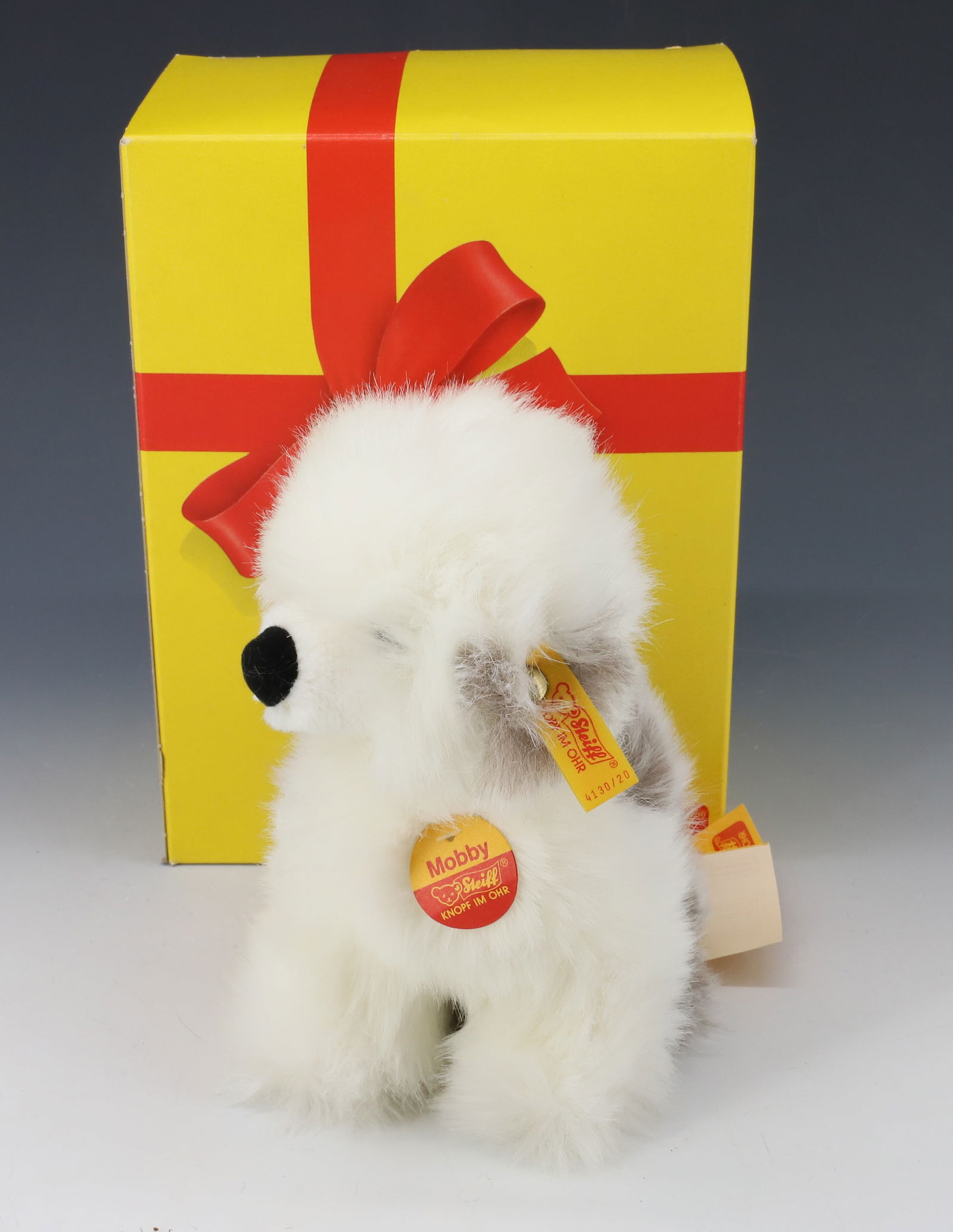 STEIFF SHEEPDOG: MOBBY WITH TAG AND BUTTON IN EAR. 8" H. WITH ORIGINAL BOX. Terms: PLEASE READ CAREFULLY - Terms for Purchasing and Shipping of Auction Items. Please read carefully before bidding. All payments for pur