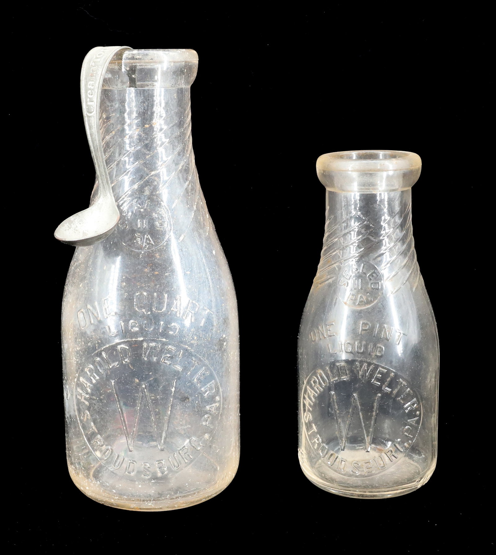 (2) STROUDSBURG, PA MILK BOTTLES: HAROLD WELTER PINT AND QUART. CREAM TOP SPOON. 7" TO 9 1/2" H. Terms: PLEASE READ CAREFULLY - Terms for Purchasing and Shipping of Auction Items. Please read carefully before bidding. All payments for