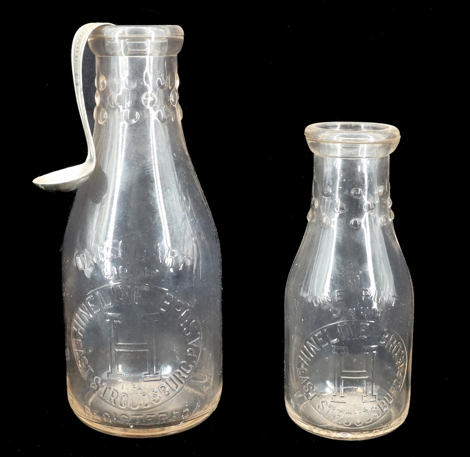 (2) EAST STROUDSBURG MILK BOTTLES: HINELINE BROS PINT AND QUART WITH CREAM TOP. 7 1/4" TO 9 1/2". Terms: PLEASE READ CAREFULLY - Terms for Purchasing and Shipping of Auction Items. Please read carefully before bidding. All payments for