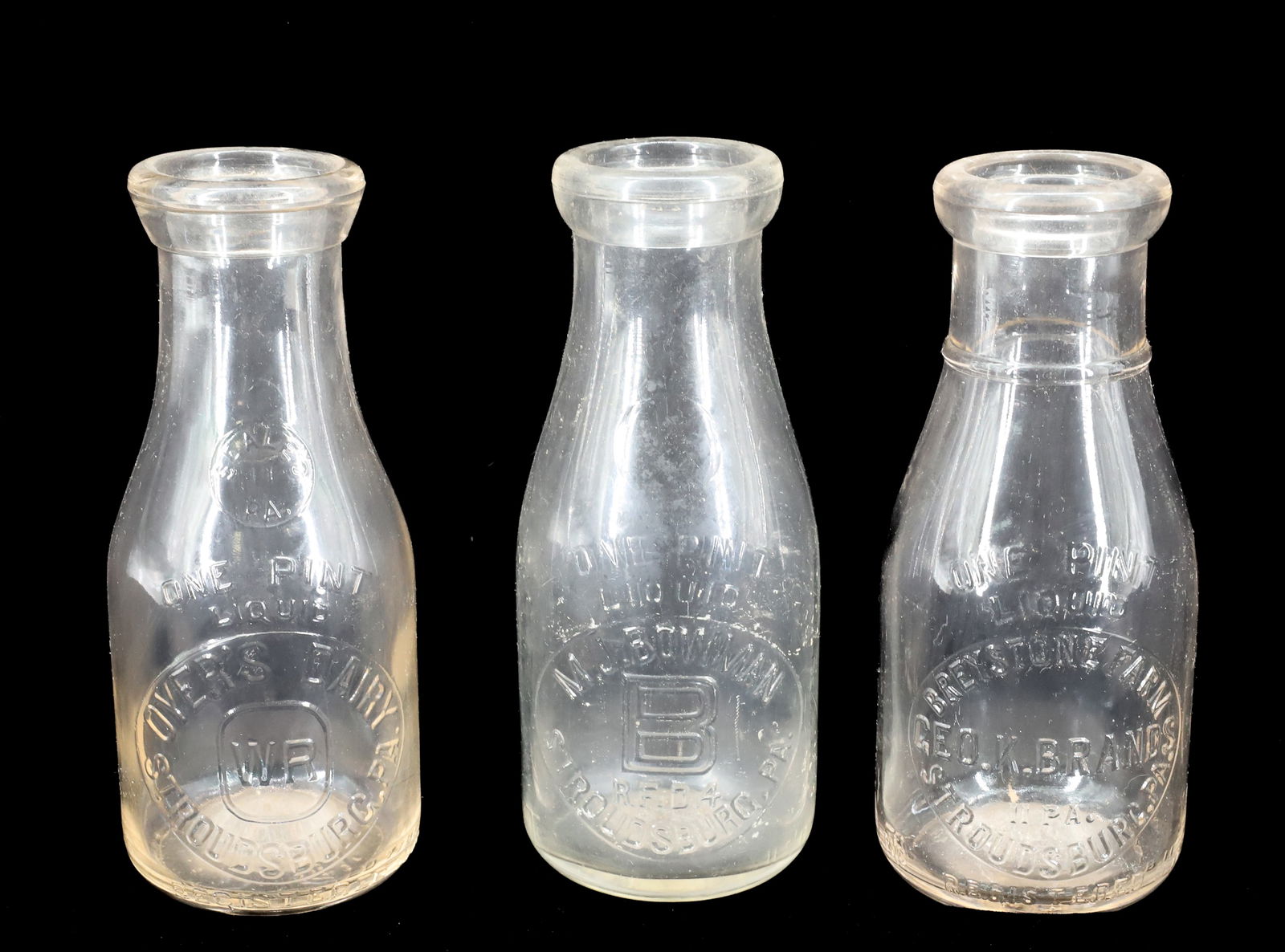 (3) STROUDSBURG, PA MILK BOTTLES: PINTS INCLUDING: M.J. BOWMAN, GEO.K. BRANDS BREYSTONE FARM AND OYER'S DAIRY. 7" H. Terms: PLEASE READ CAREFULLY - Terms for Purchasing and Shipping of Auction Items. Please read carefully before biddi