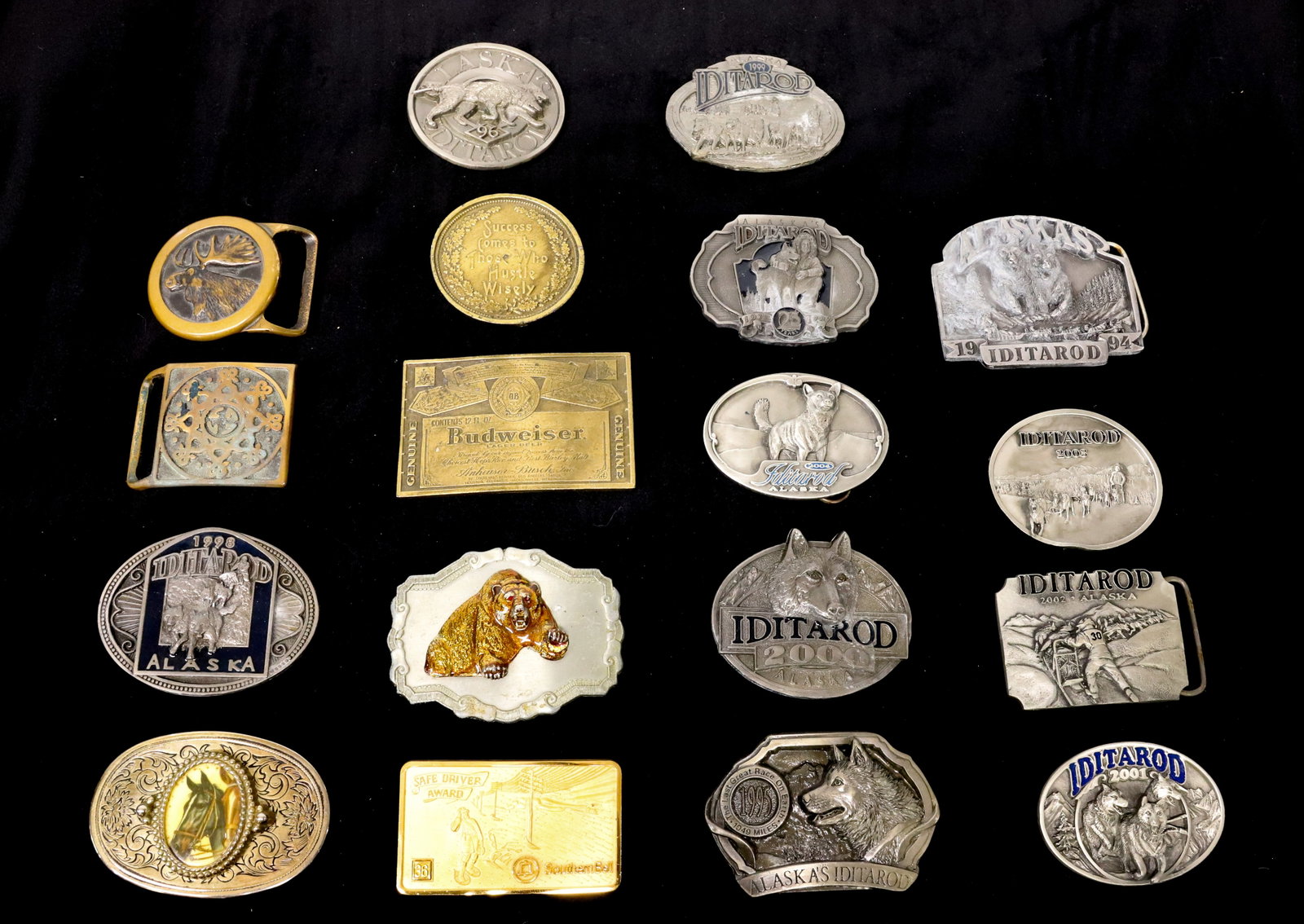 LOT OF BELT BUCKLES: PEWTER AND BRASS. SEVERAL IDITAROD, HORSE, BEAR, MOOSE AND MORE. Terms: PLEASE READ CAREFULLY - Terms for Purchasing and Shipping of Auction Items. Please read carefully before bidding. All payments f