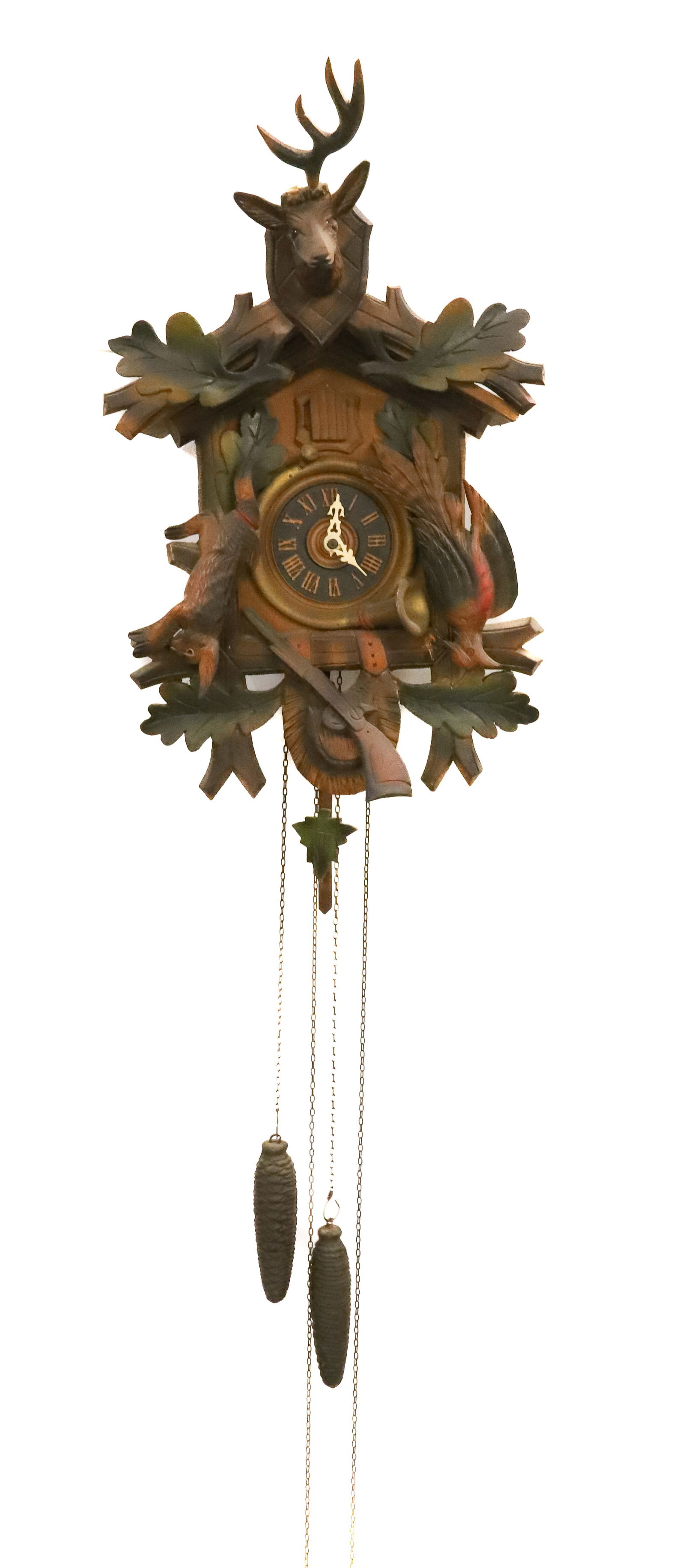 VINTAGE CUCKOO CLOCK: CARVED STAG, RABBIT, BIRD AND RIFLE. TWO PINE CONE WEIGHTS. 18" X 11" X 5". Terms: PLEASE READ CAREFULLY - Terms for Purchasing and Shipping of Auction Items. Please read carefully before bidding. All