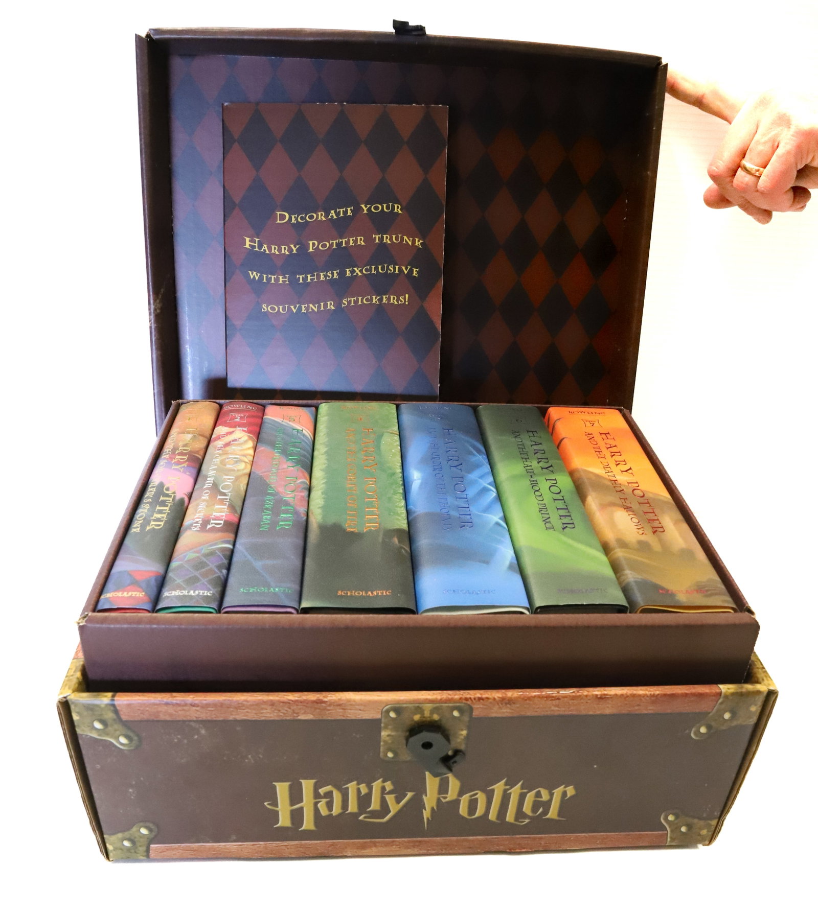 HARRY POTTER TRUNK OF BOOKS: VOLUMES 1-7. TRUNK 14" L. PLEASE READ CAREFULLY - Terms for Purchasing and Shipping of Auction Items. Please read carefully before bidding. All payments for purchases will be made through LiveAuctione