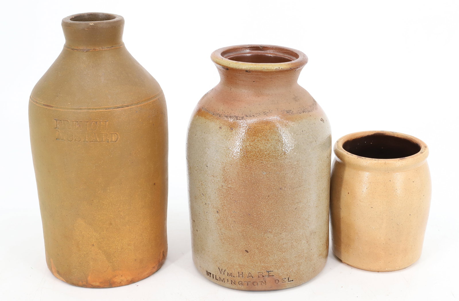 (3) STONEWARE CROCKS: TALLEST MRKD. "FRENCH MUSTARD" 8 1/2" H. GRAY CROCK IMPRESSED "WM. HART, WILMINGTON, DEL". 7 1/4" H. PLEASE READ CAREFULLY - Terms for Purchasing and Shipping of Auction Items. Please read carefully b