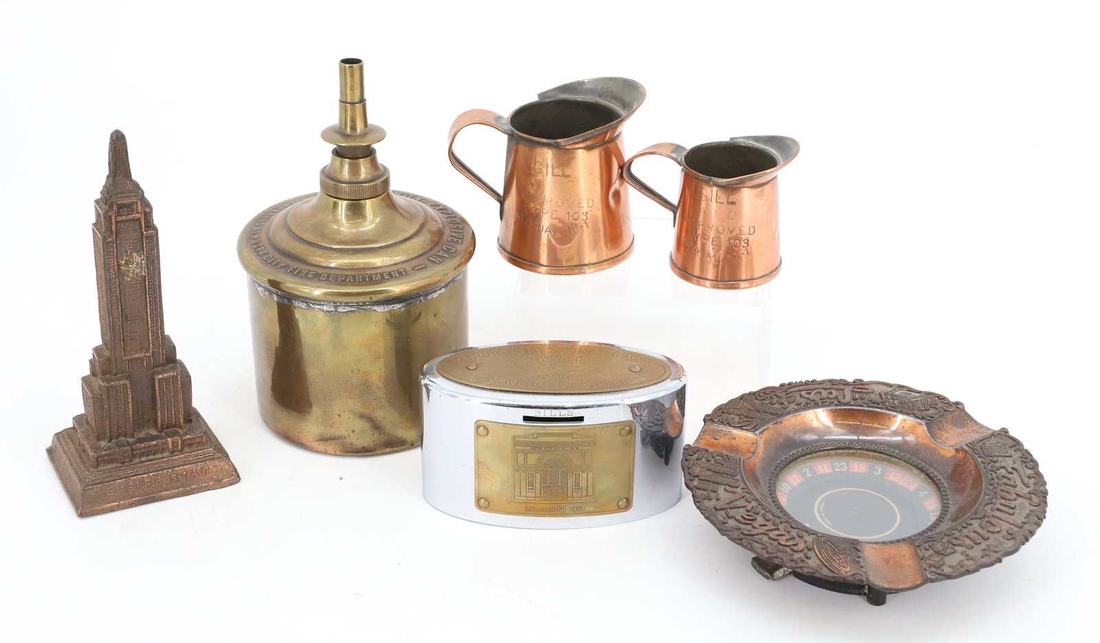 LOT OF VINTAGE BRASS AND COPPER ITEMS: INCLUDING: MCNUTT NON-EXPLOSIVE CAN 6" H, 1 GILL AND 1/2 GILL COPPER MEASURES, EMPIRE CITY SAVINGS BANK, NEW YORK 4" L., EMPIRE STATE BUILDING SOUVENIR, AND LAS VEGAS ASHTRAY 5" D. PLEASE READ CAREFUL