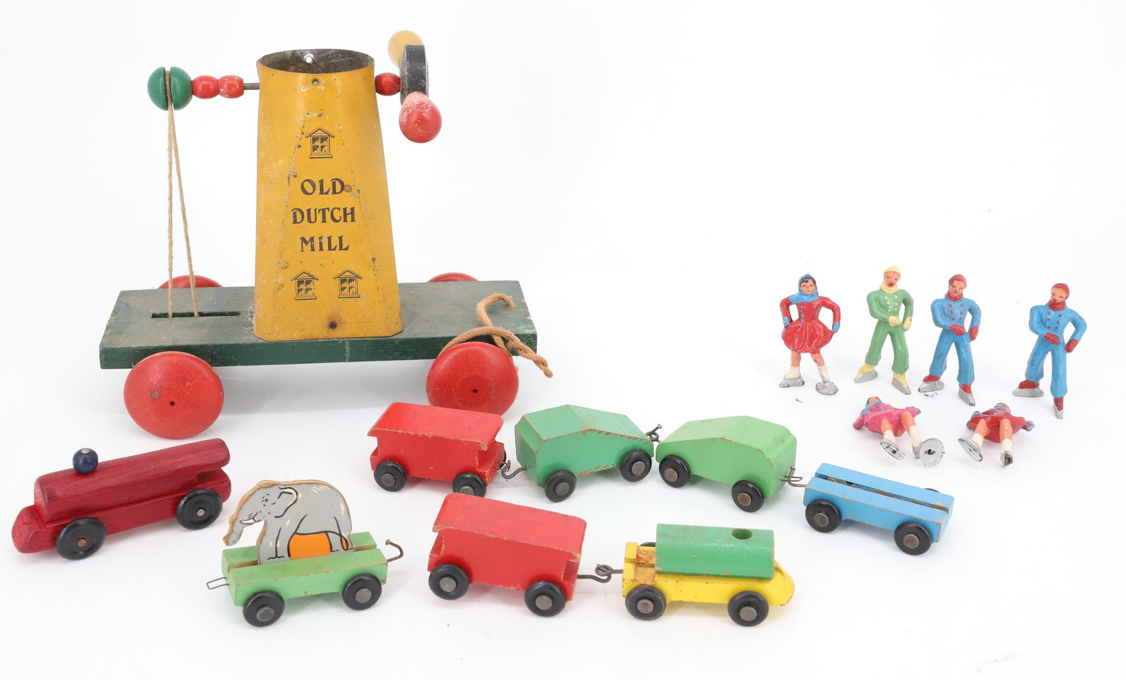 LOT OF VINTAGE TOYS: INCLUDING: PAINTED LEAD SKATERS, WOODEN TRAIN AND "OLD DUTCH MILL" 8" L. PLEASE READ CAREFULLY - Terms for Purchasing and Shipping of Auction Items. Please read carefully before bidding. All payments 