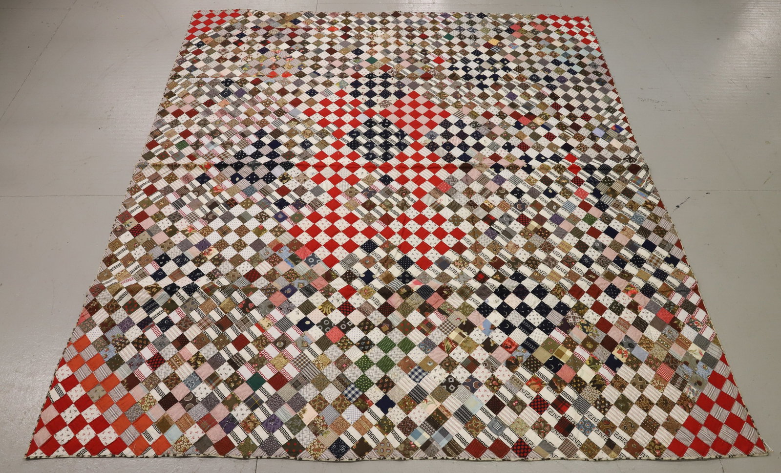 VINTAGE HAND STITCHED QUILT: DIAMOND PATTERN WITH VARIOUS FABRICS. 75" X 82". THIN BATTING. PLEASE READ CAREFULLY - Terms for Purchasing and Shipping of Auction Items. Please read carefully before bidding. All payments for purcha
