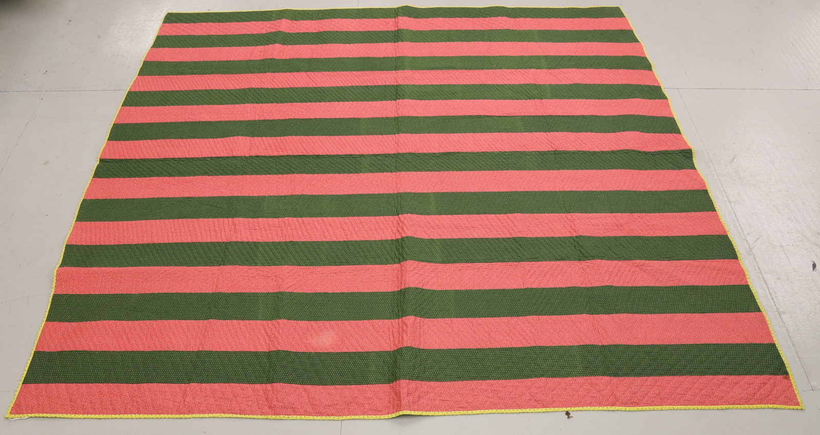 VINTAGE HAND STITCHED QUILT: GREEN/PINK BAR QUILT WITH BROWN FLORAL BACKING. THIN BATTING. 71" X 80". PLEASE READ CAREFULLY - Terms for Purchasing and Shipping of Auction Items. Please read carefully before bidding. All payments 