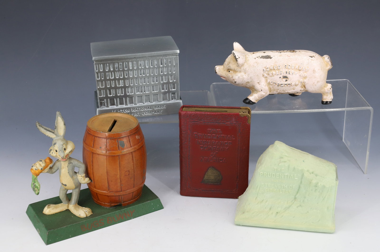 LOT OF STILL BANKS: (5) INCLUDING; BUGS BUNNY, EASTON BANK AND TRUST CO. ( 4 1/4" L ), PRUDENTIAL INSURANCE, CAST IRON NORCO, POTTSTOWN, PA PIG BANK PLEASE READ CAREFULLY - Terms for Purchasing and Shipping of Auction It