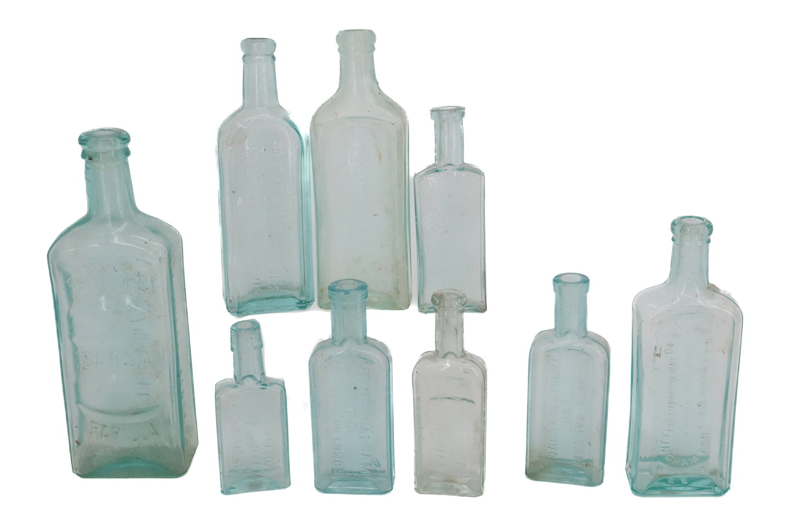 LOT OF AQUA ADVERTISING BOTTLES: (9) INCLUDING; VARIOUS EMBOSSED BOTTLES - LARGEST IS HOOD'S SARSAPARILLA (9" H) PLEASE READ CAREFULLY - Terms for Purchasing and Shipping of Auction Items. Please read carefully before bidding. All pa