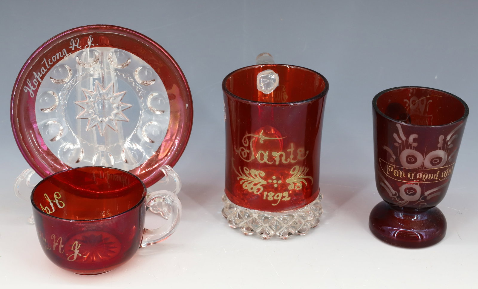 LOT OF RUBY FLASH ITEMS: INCLUDING: MUG "TANTE, 1892" 4" H., FOOTED MUG "FOR A GOOD GIRL" AND CUP/SAUCER "HOPATCONG, NJ". PLEASE READ CAREFULLY - Terms for Purchasing and Shipping of Auction Items. Please read carefully befor