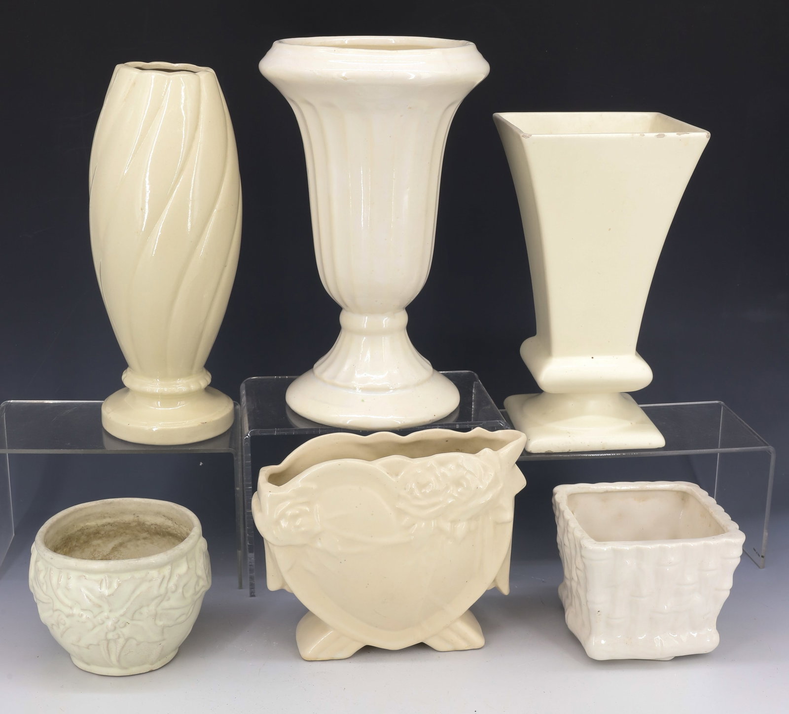 LOT OF VINTAGE POTTERY VASES: IVORY VASES IN VARIOUS SIZES AND FORMS. LARGEST 10" H. ONE MRKD. HAEGER (WEAR AT GLAZE TOP EDGE). SMALLEST HAS DISCOLOR ON INTERIOR. PLEASE READ CAREFULLY - Terms for Purchasing and Shipping of Auctio