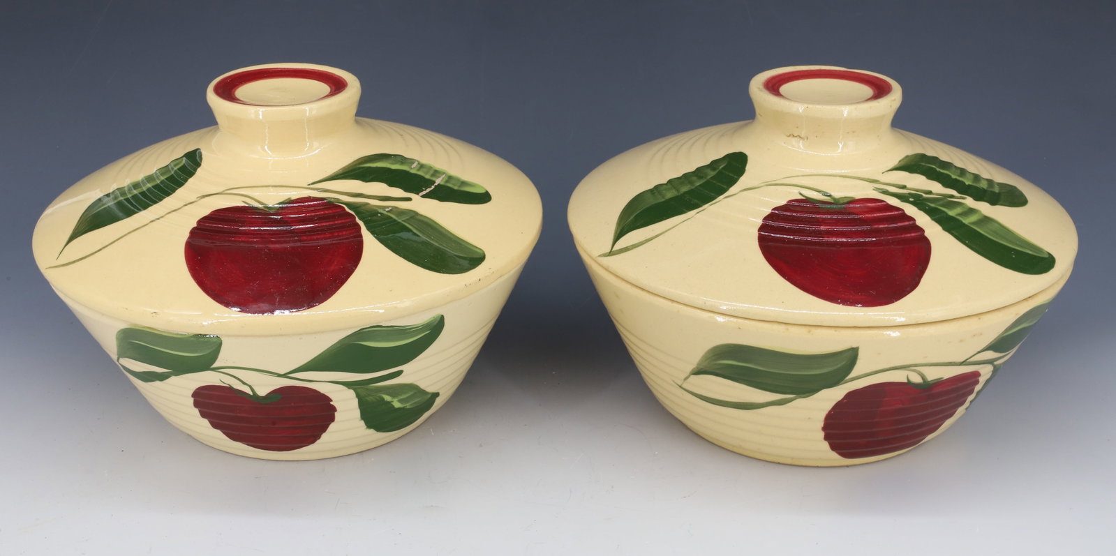 (2) WATT WARE COVERED CASSEROLE DISHES: APPLE PATTERN. 8 3/4" D. PLEASE READ CAREFULLY - Terms for Purchasing and Shipping of Auction Items. Please read carefully before bidding. All payments for purchases will be made through LiveAuctionee