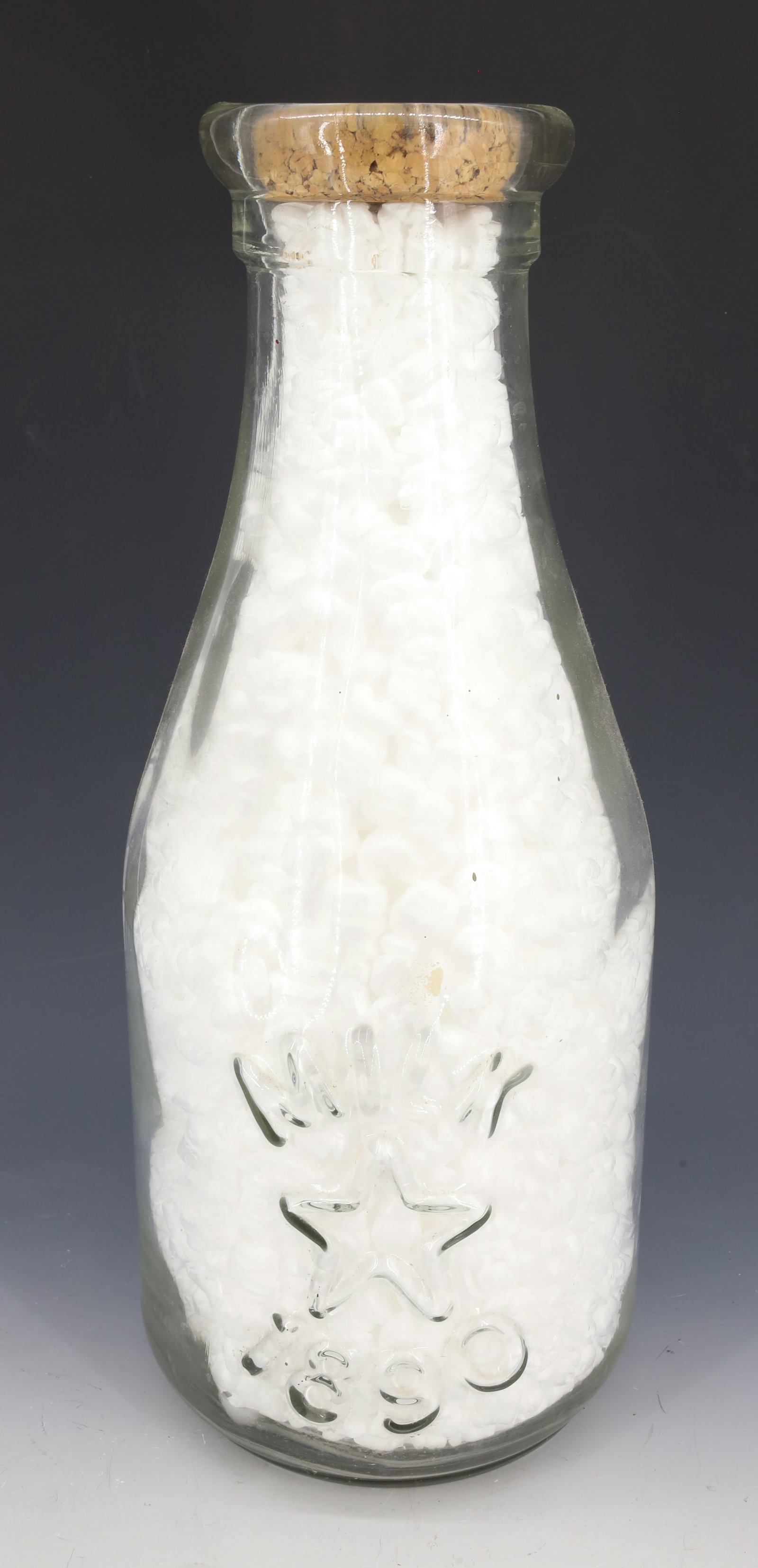 LARGE EMBOSSED MILK BOTTLE: CORK STOPPER. EMBOSSED "MILK" WITH STAR AND 1890. 18" H. PLEASE READ CAREFULLY - Terms for Purchasing and Shipping of Auction Items. Please read carefully before bidding. All payments for purchases wi