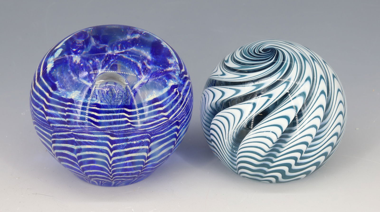 (2) ART GLASS SIGNED PAPERWEIGHTS: BLUE AND WHITE SWIRL SIGNED MRS. CLARICE M. HOUSE, AND CONTROLLED BUBBLE WITH BLUE SIGNED GRYGUTIS 3"H PLEASE READ CAREFULLY - Terms for Purchasing and Shipping of Auction Items. Please read carefully