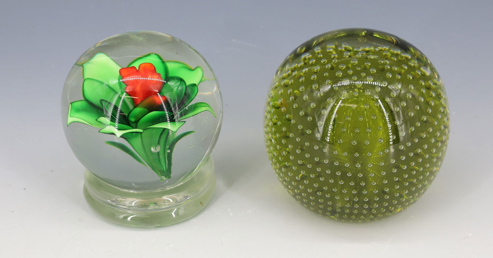 (2) ART GLASS PAPERWEIGHTS: FORMED FLOWER WITH RIBBED BASE ROUGH PONTIL, CONTROLLED BUBBLES GREEN FIRE POLISHED PONTIL 3 1/2"H PLEASE READ CAREFULLY - Terms for Purchasing and Shipping of Auction Items. Please read carefully bef