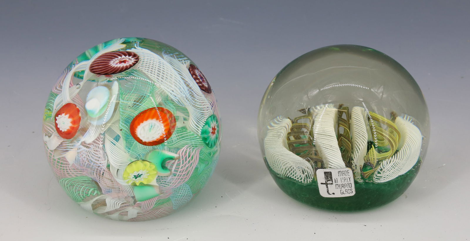(2) ART GLASS PAPERWEIGHTS: BOTH HAVE MURANO LABELS MILLEFIORI AND STRIPES OF CAINES 2 3/4"H,3"H PLEASE READ CAREFULLY - Terms for Purchasing and Shipping of Auction Items. Please read carefully before bidding. All payments for