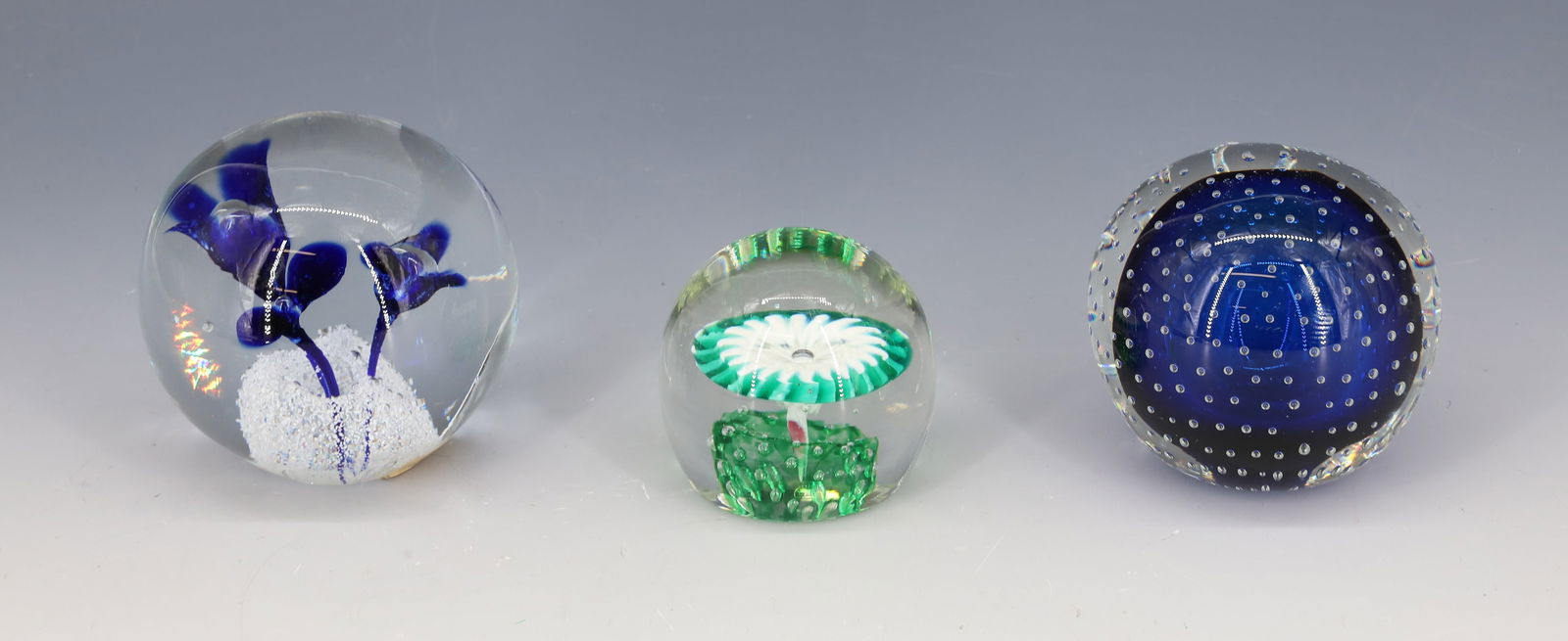 (3) ART GLASS PAPERWEIGHTS: THREE COBALT FLOWERS WITH CLEAR BUBBLES BOHEMIA LABEL, COBALT BLUE CONTROLLED BUBBLES AND GREEN AND WHITE FORMED FLOWER 2"H,2 3/4"H,3"H PLEASE READ CAREFULLY - Terms for Purchasing and Shipping of Auc