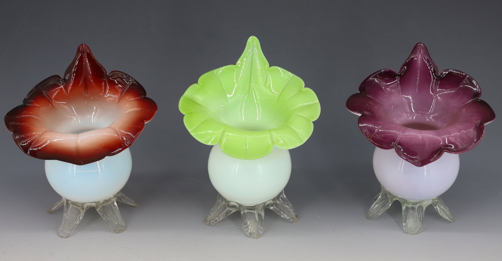 (3) VICTORIAN JACK-IN-THE-PULPIT VASES: CASED GLASS IN PURPLE, LIME GREEN AND DARK RED, APPLIED CLEAR FEET HANDBLOWN WITH ROUGH PONTILS 6 3/4"H PLEASE READ CAREFULLY - Terms for Purchasing and Shipping of Auction Items. Please read carefull