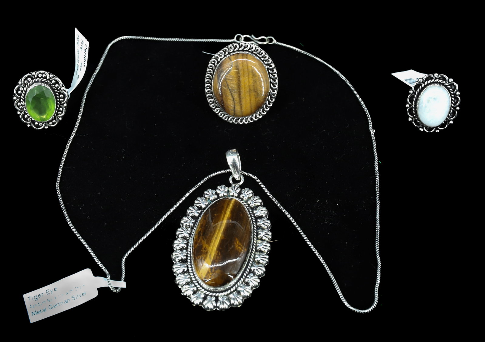(4) SEMI PRECIOUS STONE JEWELRY: TIGERS EYE PENDANT AND RING SIZE 6 PERIDOT AND MOONSTONE RINGS SIZE 6 CHAIN 20" PENDANT 2" PLEASE READ CAREFULLY - Terms for Purchasing and Shipping of Auction Items. Please read carefully before bidd